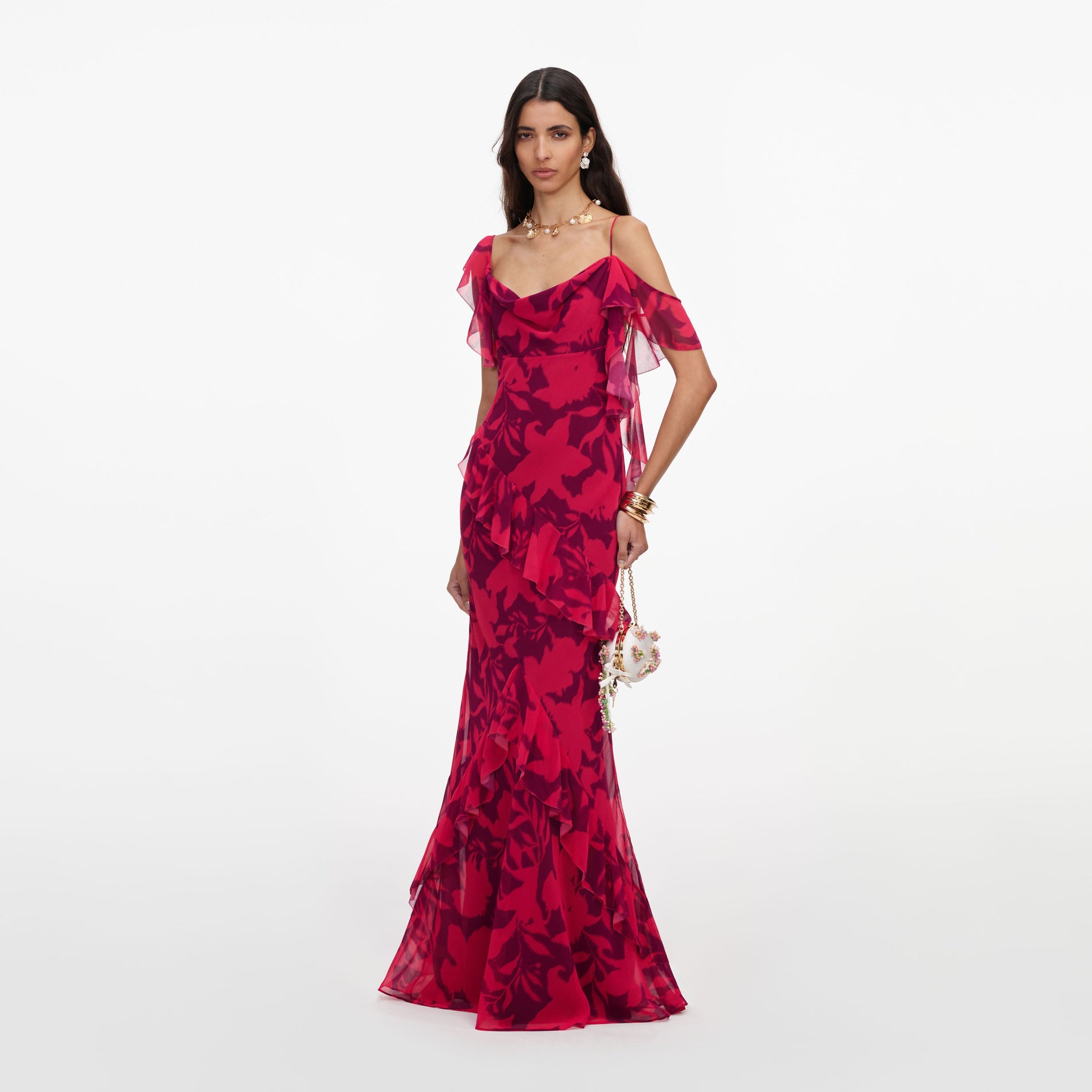 Side view of a woman wearing the Pink Floral Ruffle Maxi Dress