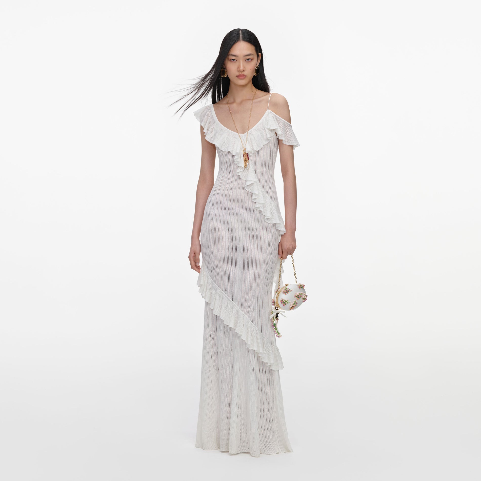 Front view of a woman wearing the White Ruffle Knit Maxi Dress