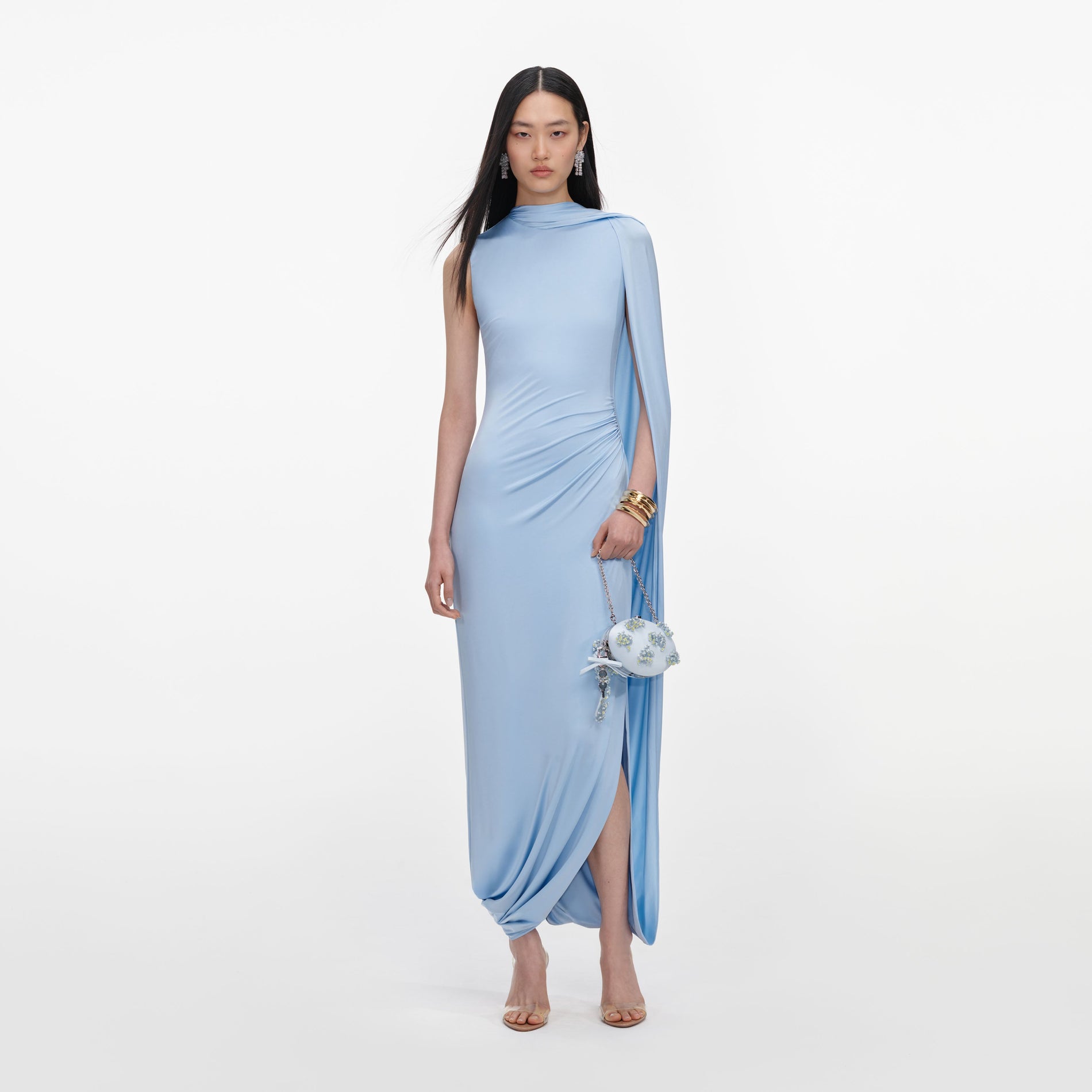 Front view of a woman wearing the Blue Jersey Draped Maxi Dress