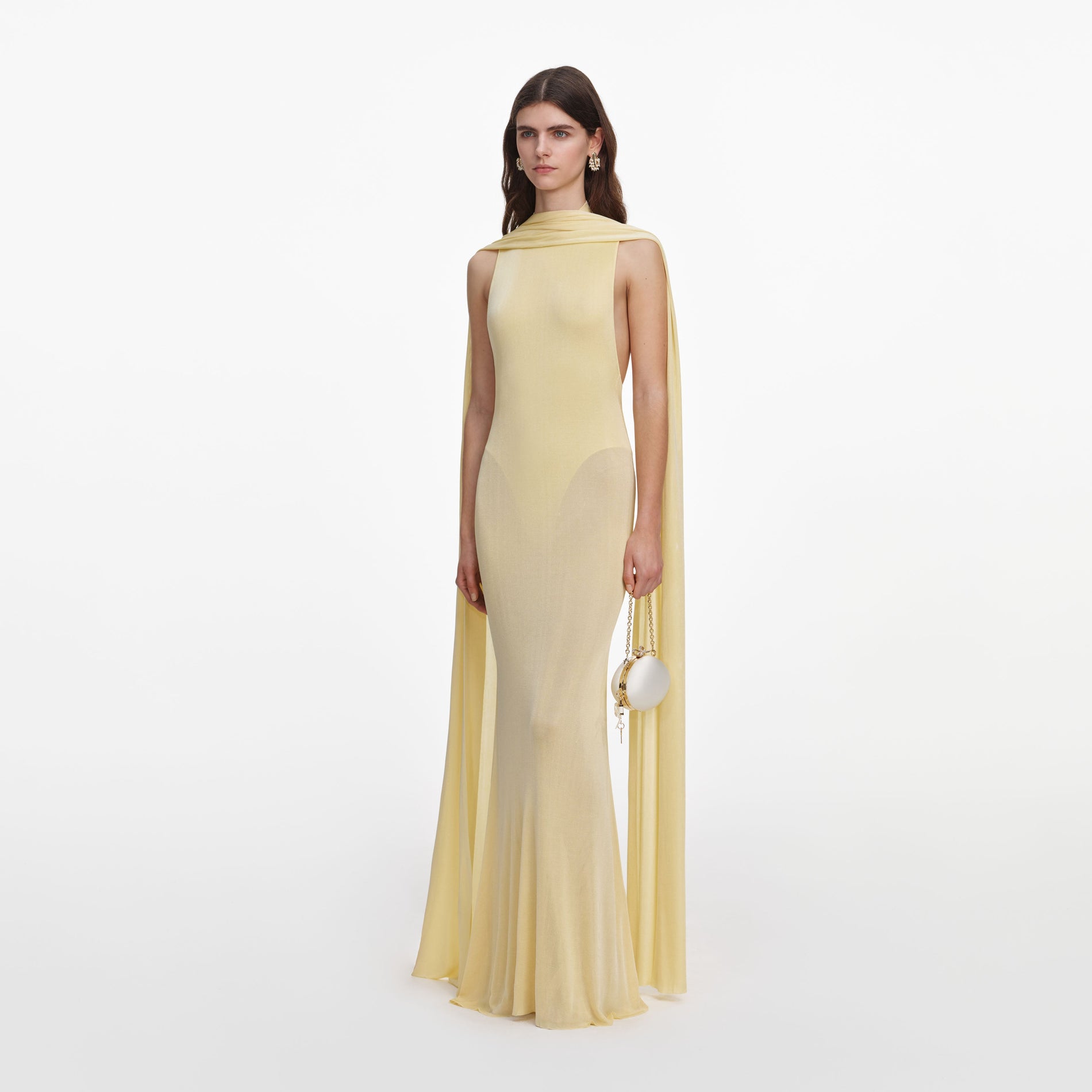 Side view of a woman wearing the Yellow Viscose Knit Scarf Maxi Dress