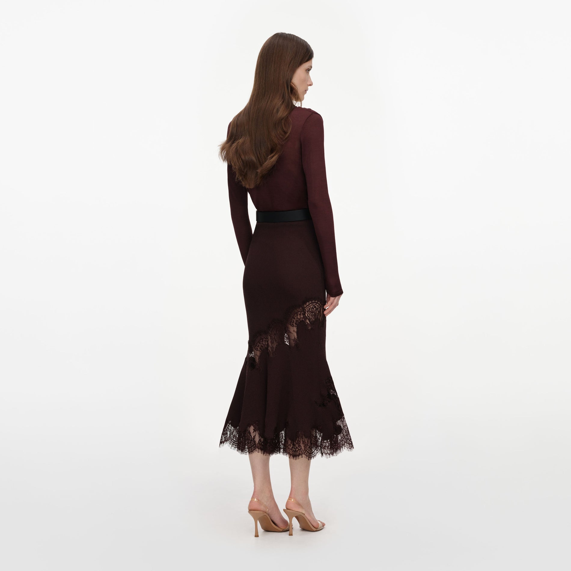 Back view of a woman wearing the Brown Ribbed Knit Midi Skirt