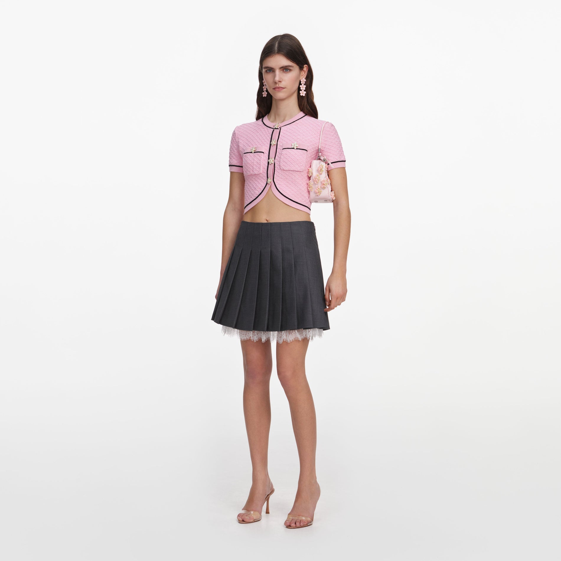 Side view of a woman wearing the Pink Flower Knit Top