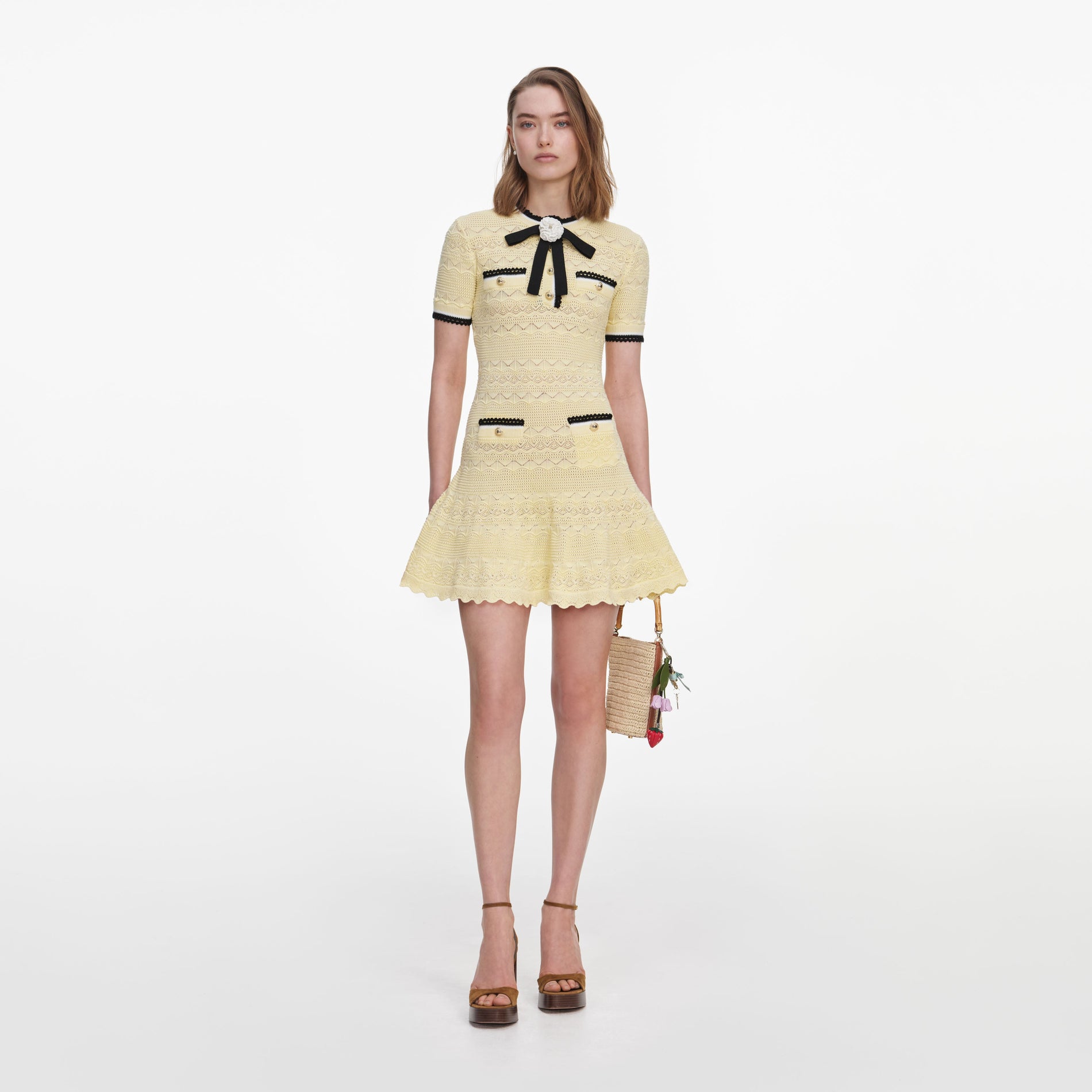 Front view of a woman wearing the Yellow Pointelle Knit Mini Dress