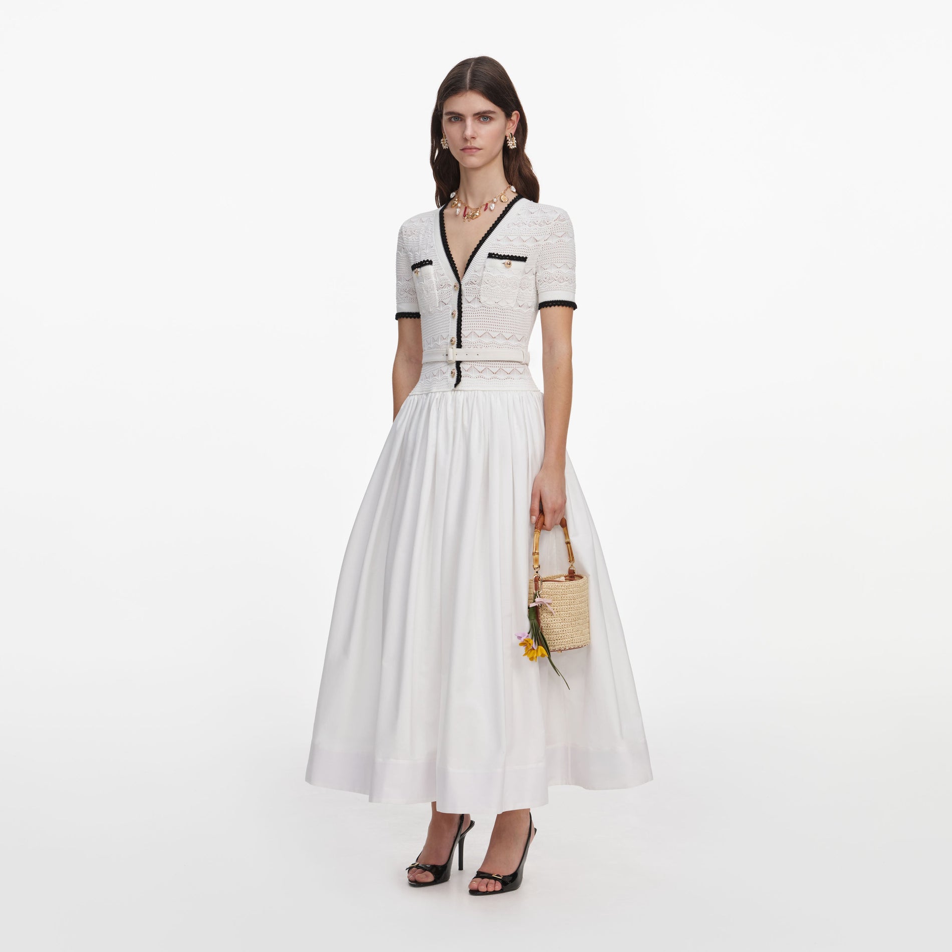 Side view of a woman wearing the White Knit Linen Midi Dress