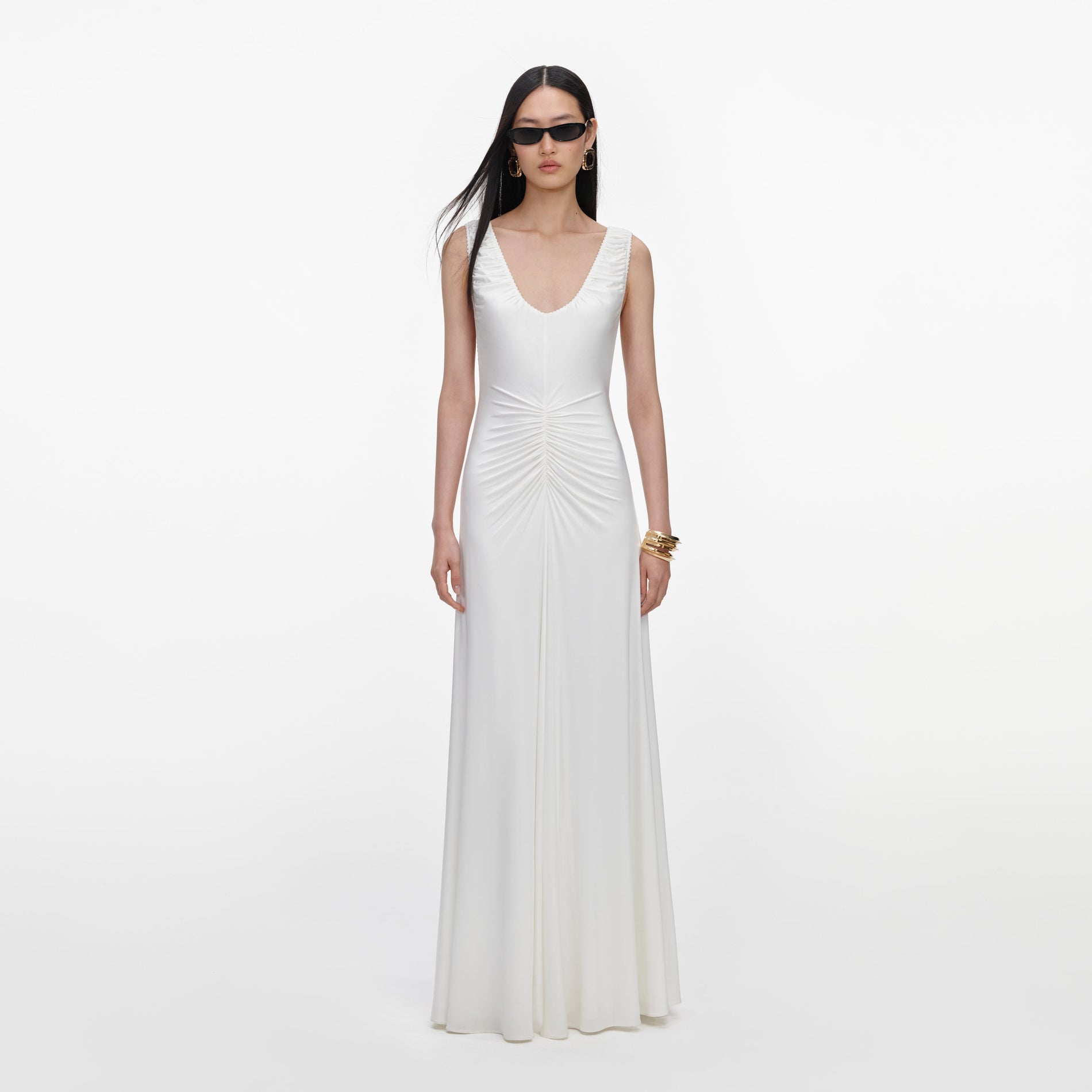 Front view of a woman wearing the White Jersey Ruched Maxi Dress