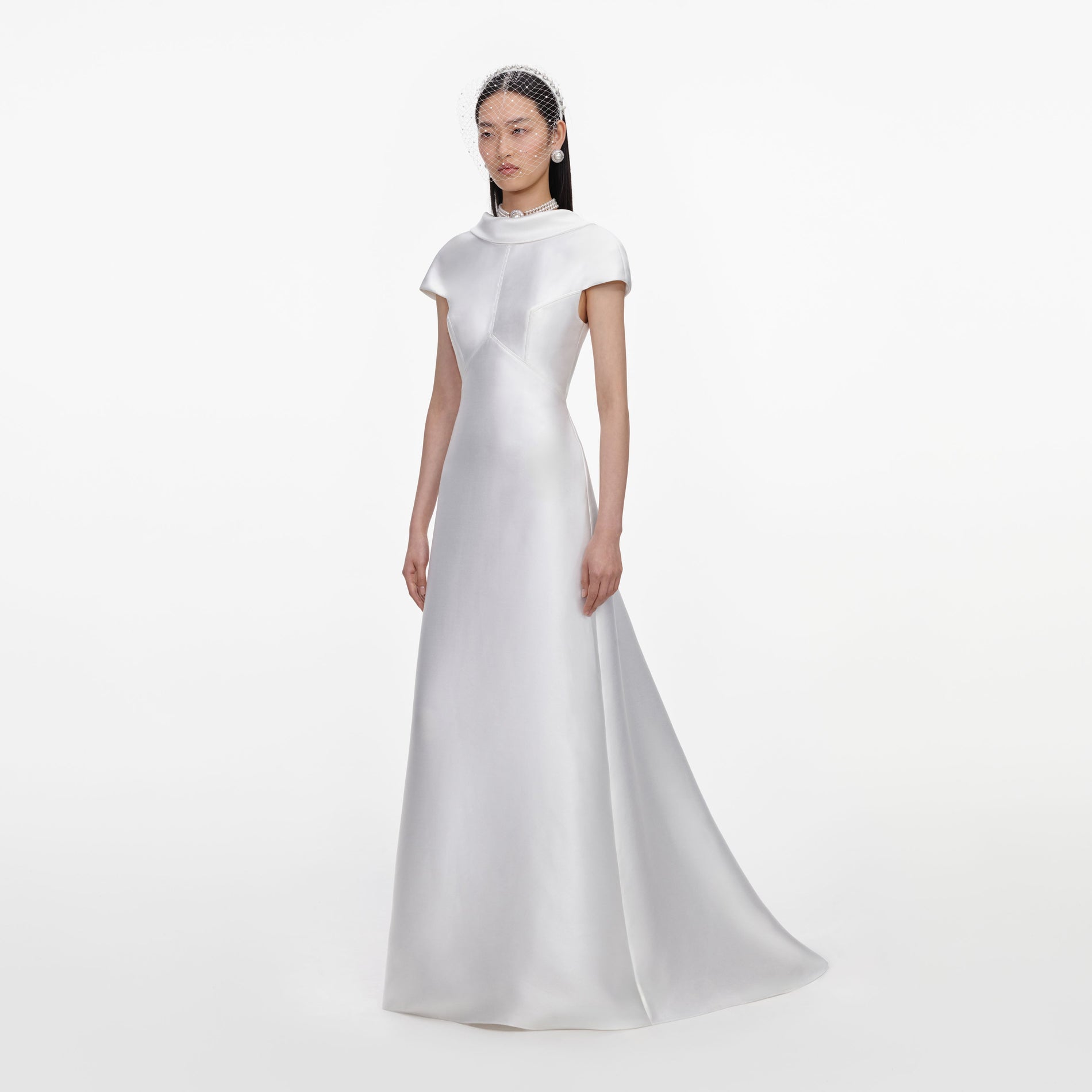 Side view of a woman wearing the White Taffeta Collared Maxi Dress