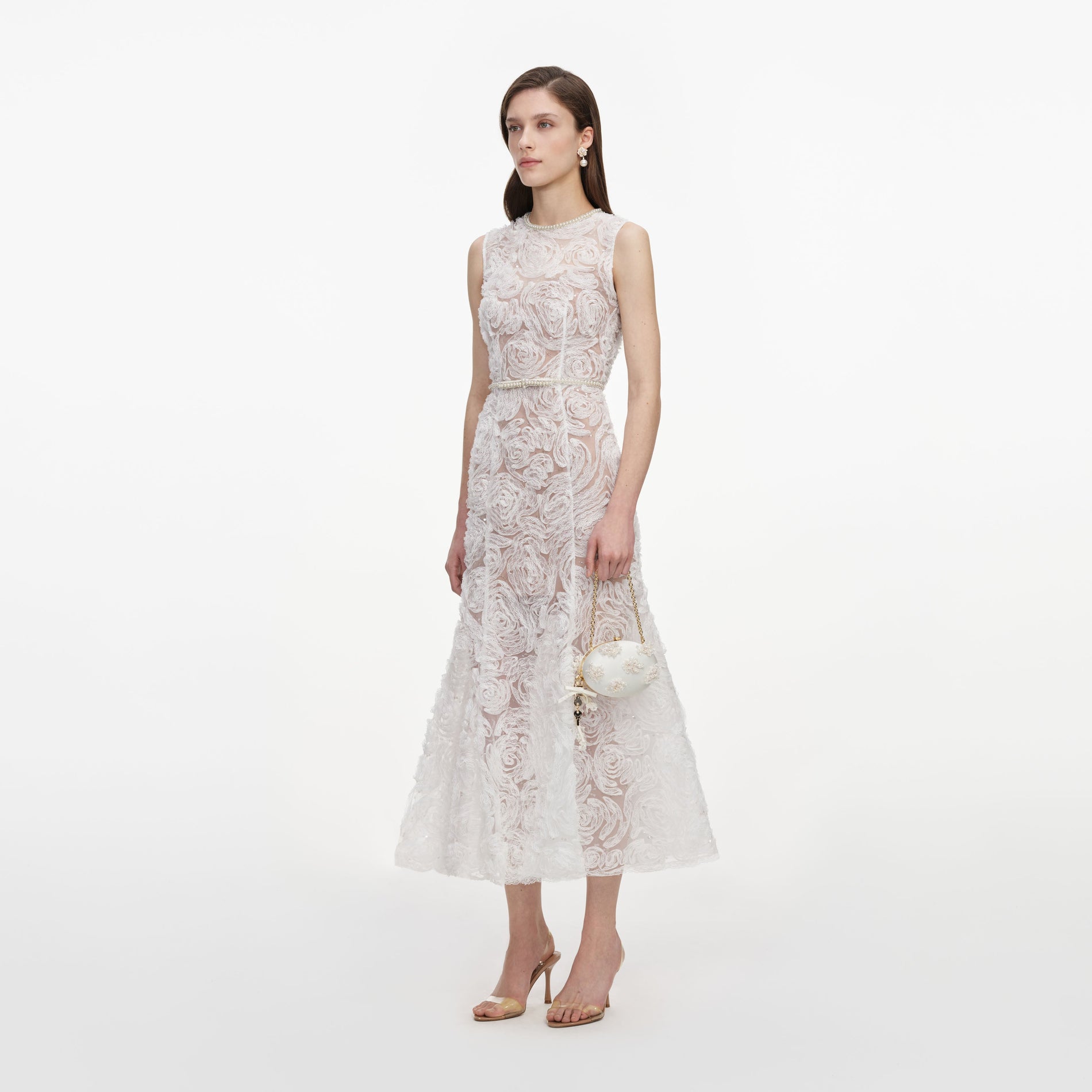 Side view of a woman wearing the White Tulle Lace Midi Dress