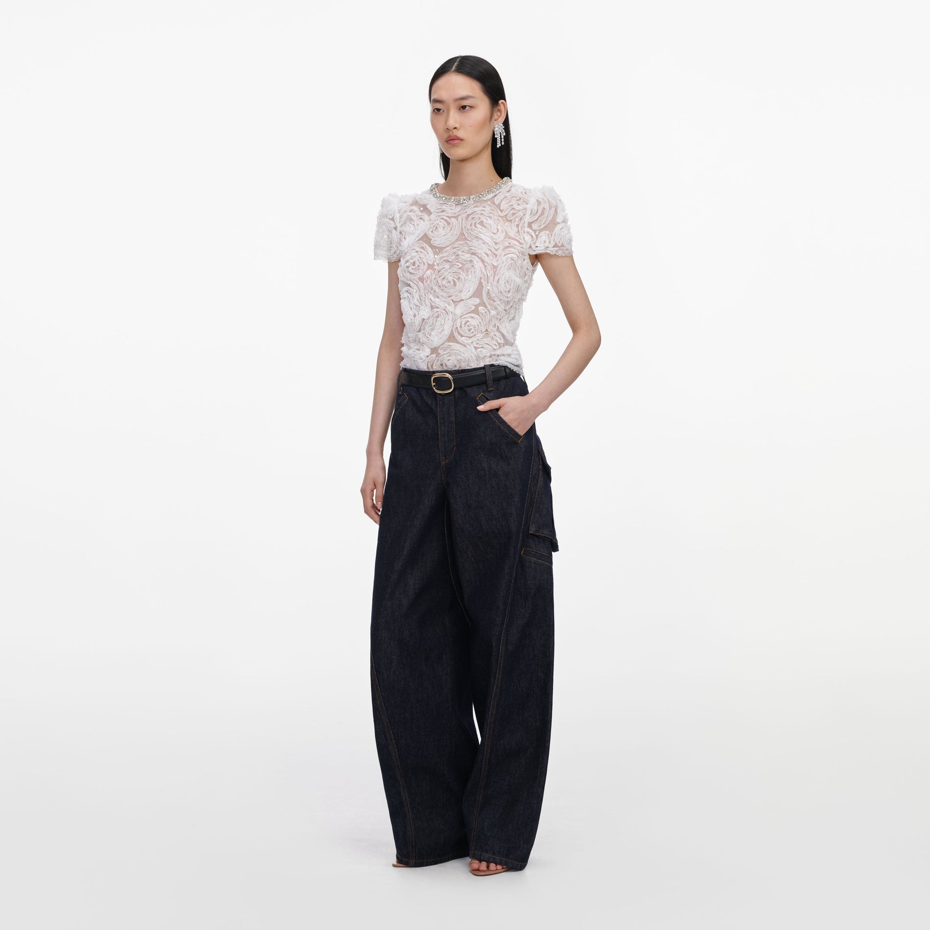 Side view of a woman wearing the White Tulle Lace Top