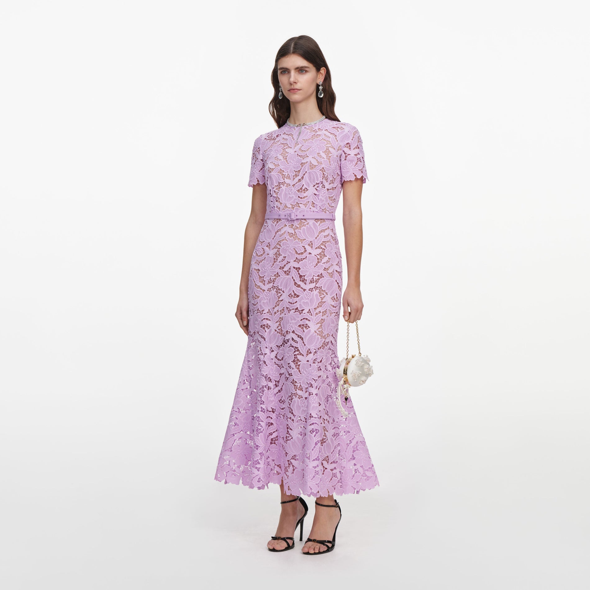 Side view of a woman wearing the Lilac Lace Midi Dress