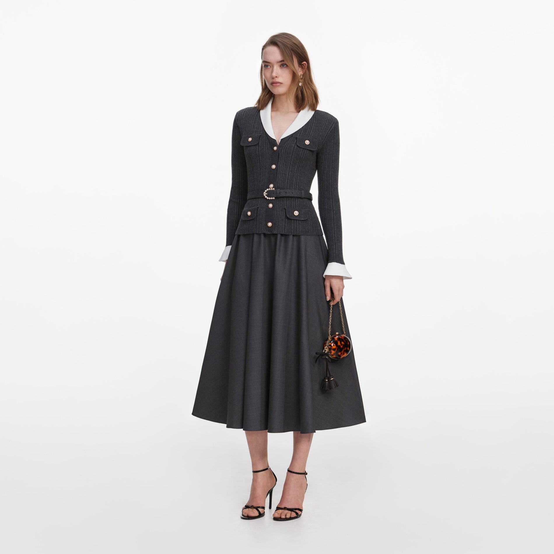 Side view of a woman wearing the Grey Knit Twill Midi Dress