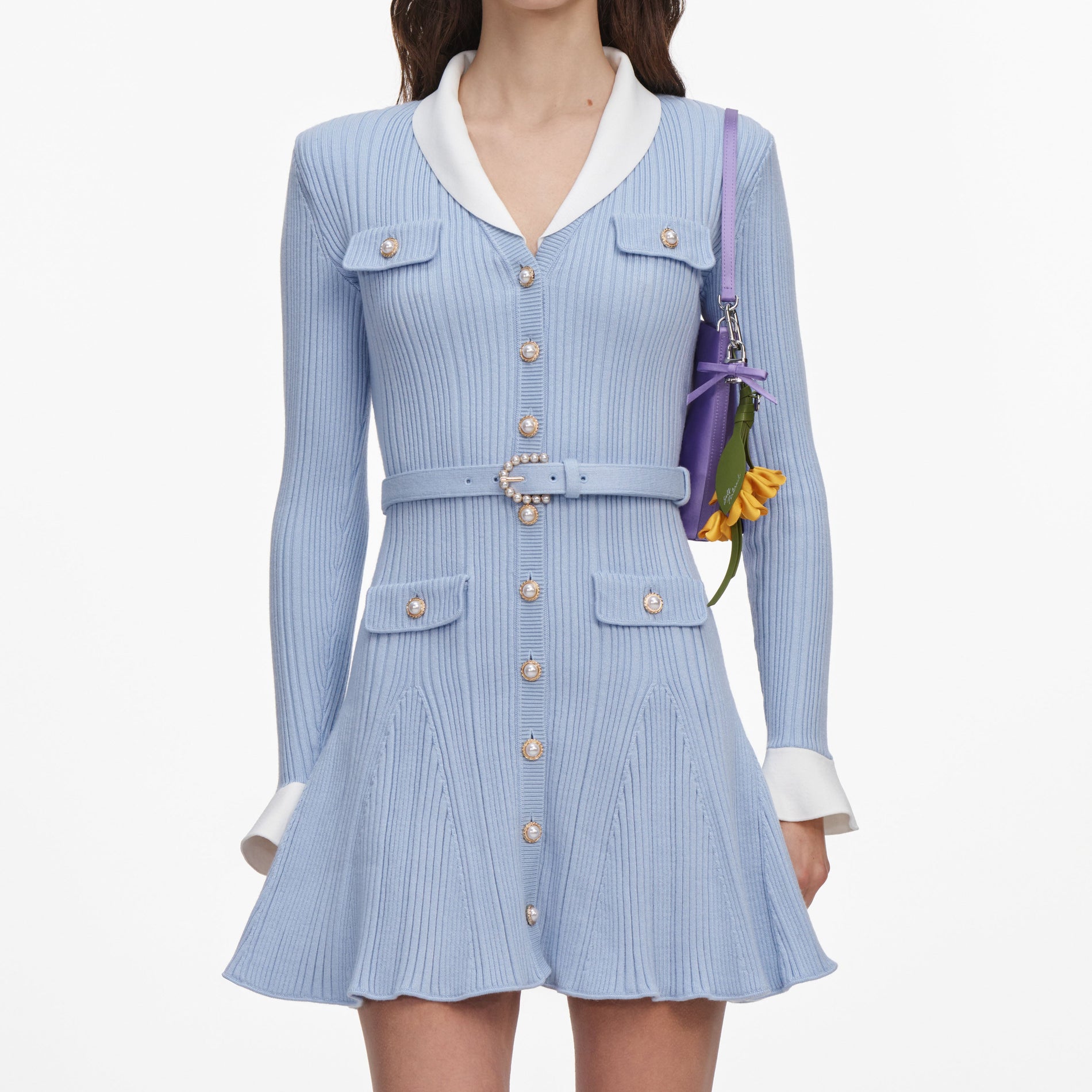 A close up of a woman wearing the Blue Ribbed Knit Mini Dress