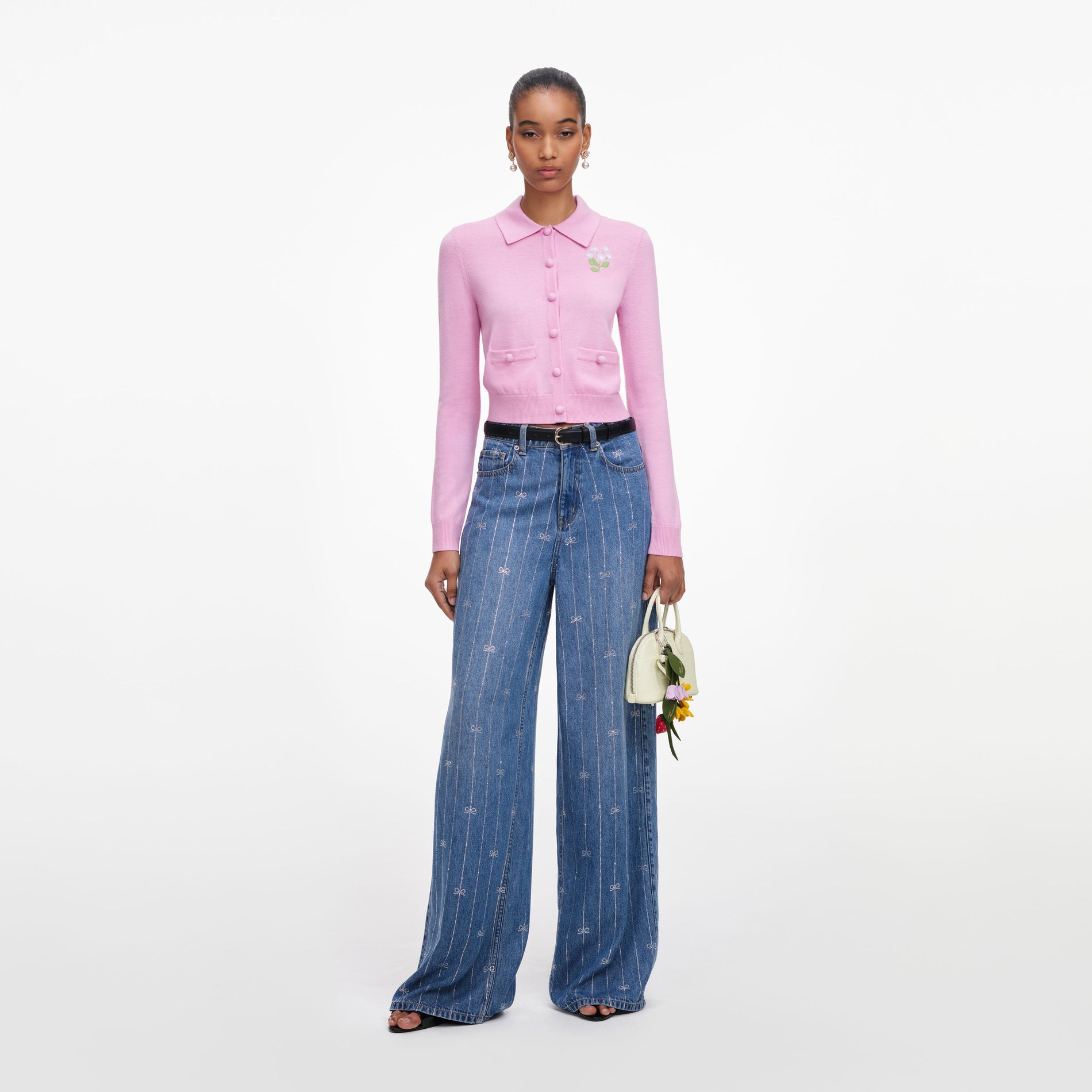 Front view of a woman wearing the Pink Flower Embroidered Knit Cardigan