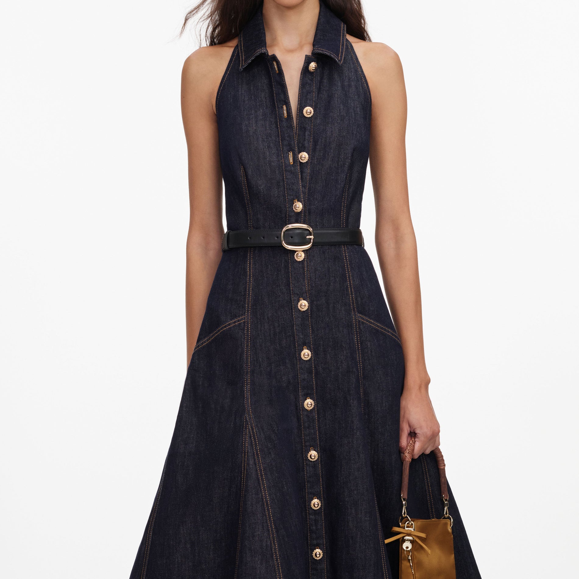 A close up of a woman wearing the Indigo Denim Halterneck Midi Dress