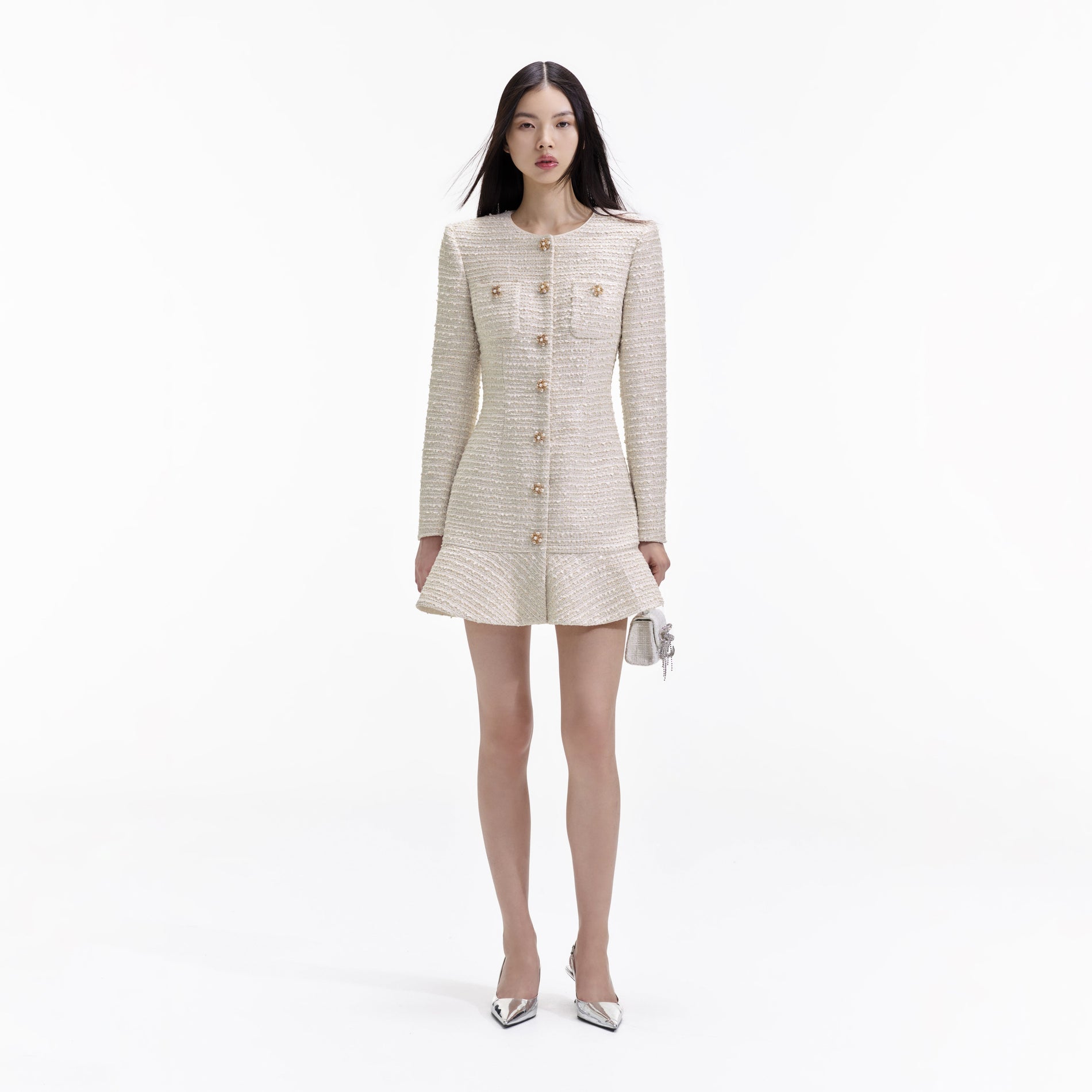 Front view of a woman wearing the Gold Boucle Long Sleeve Mini Dress