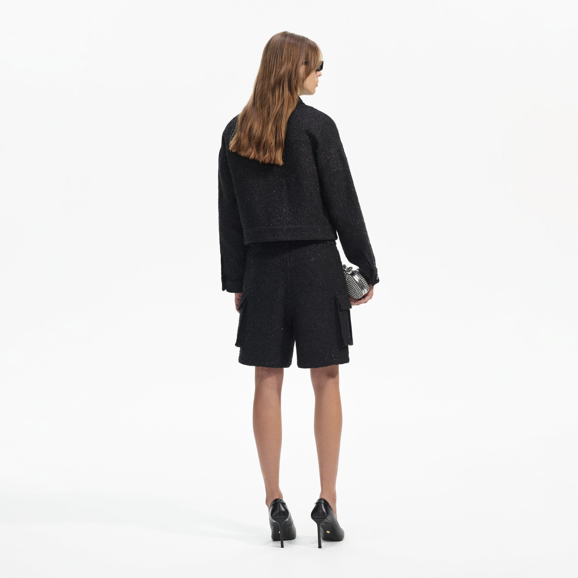 Back view of a woman wearing the Black Boucle Oversized Jacket