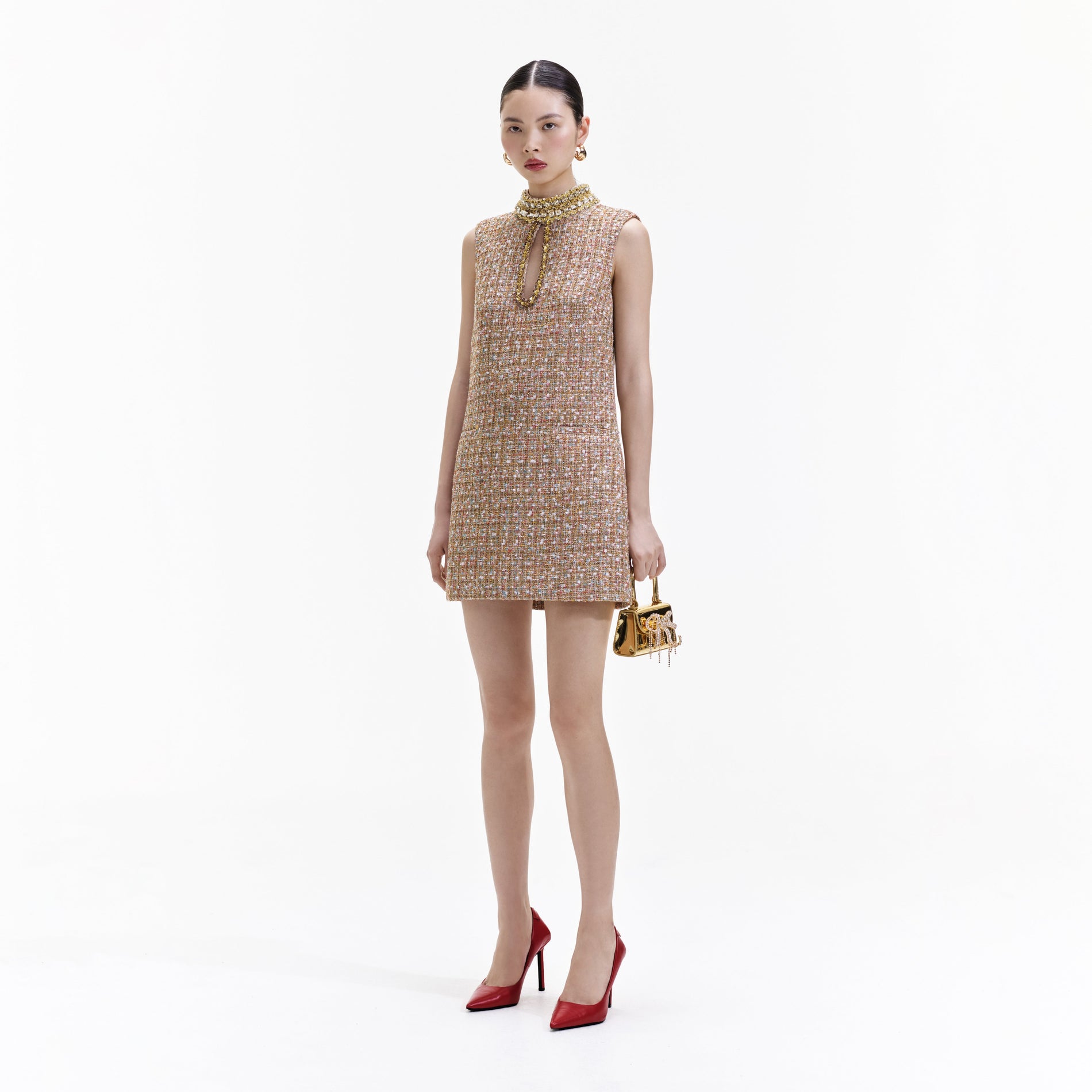 Side view of a woman wearing the Gold Tinsel Boucle Embellished Mini Dress
