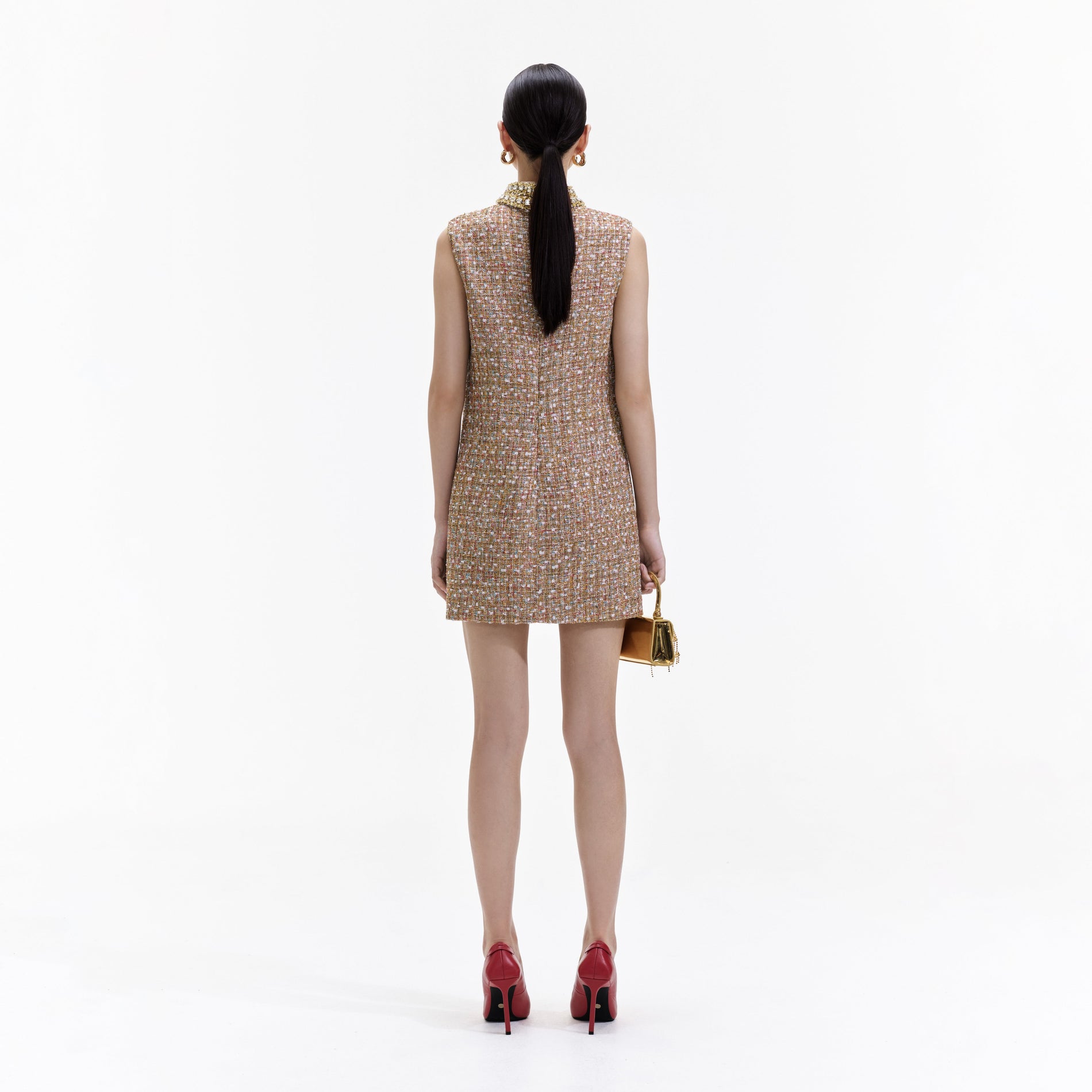 Back view of a woman wearing the Gold Tinsel Boucle Embellished Mini Dress