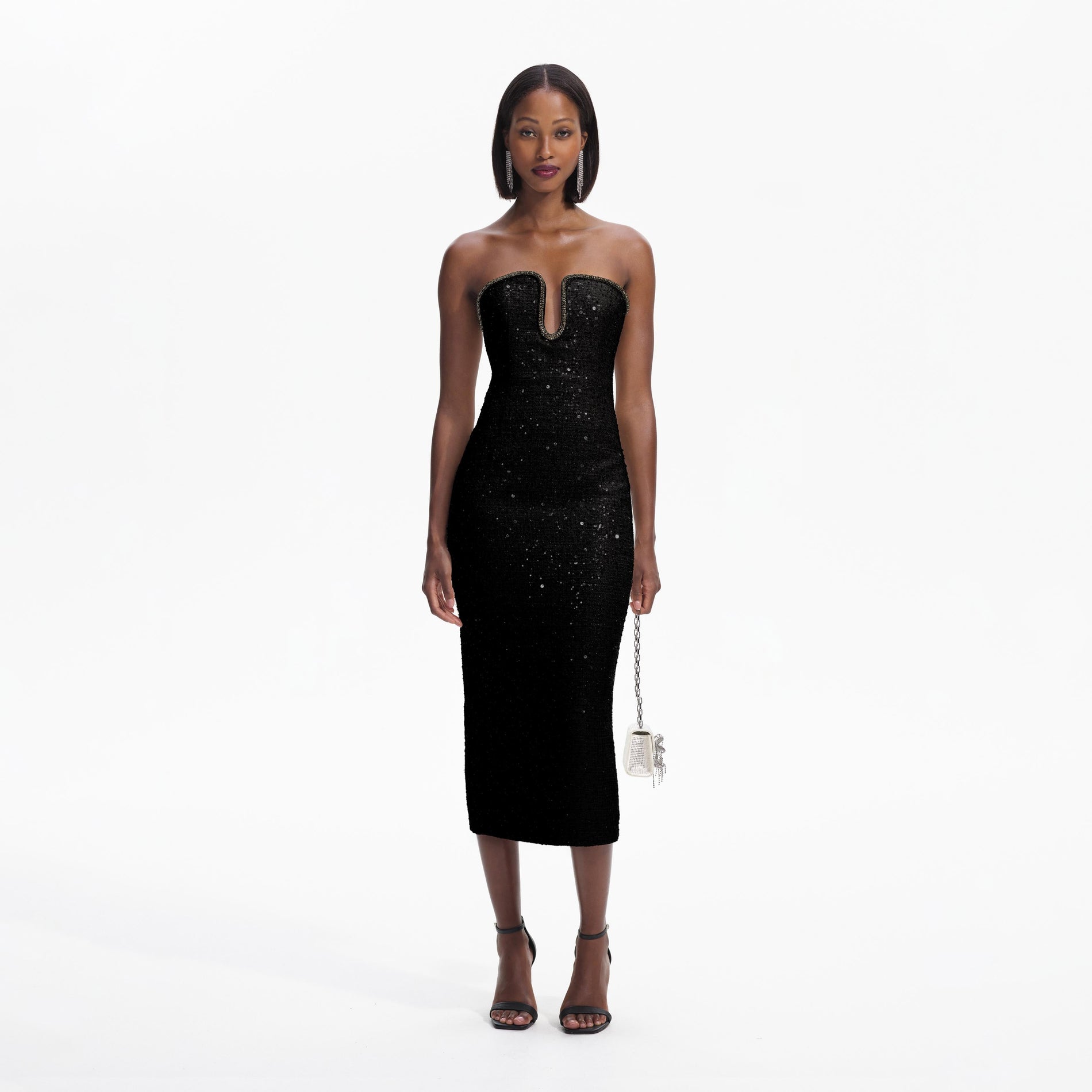 Front view of a woman wearing the Black Sequin Boucle Midi Dress