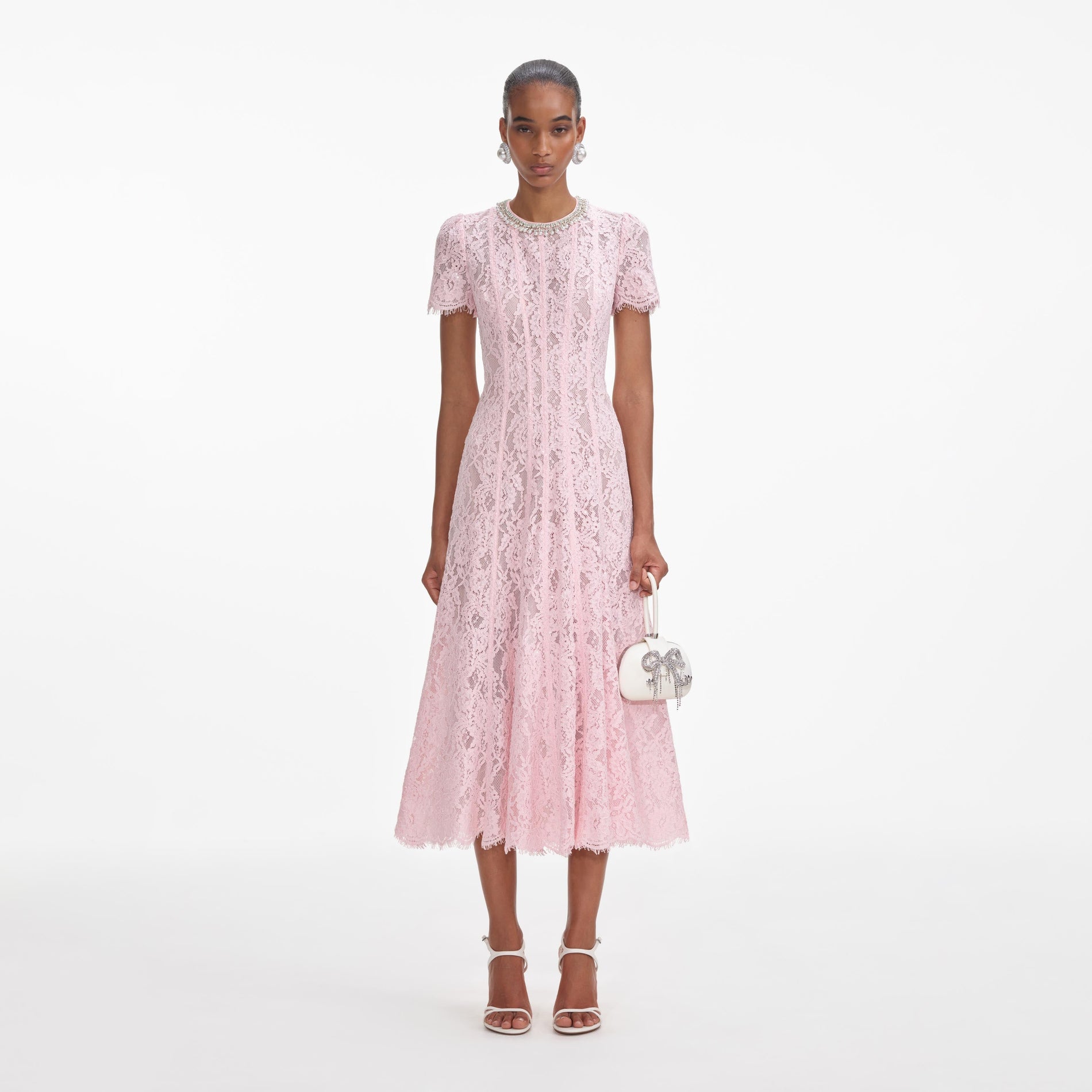 Front view of a woman wearing the Pink Lace Embellished Midi Dress