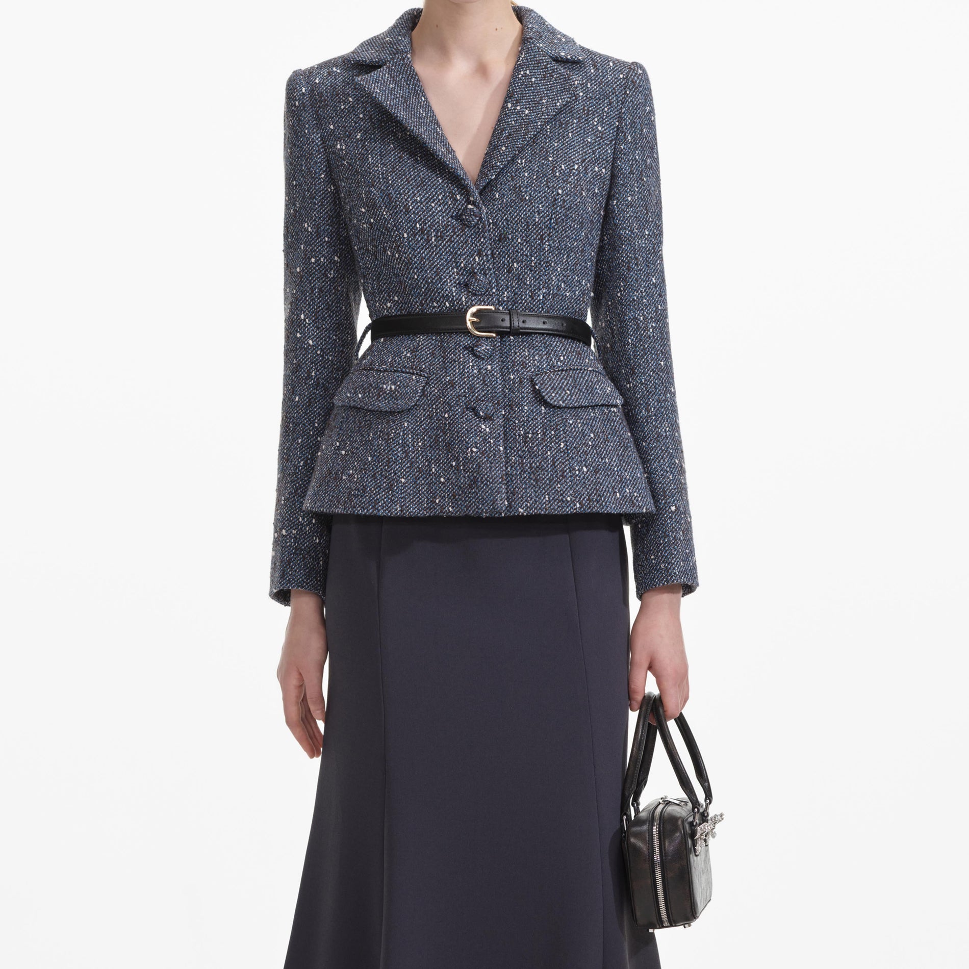 A close up of a woman wearing the Blue Boucle Midi Dress