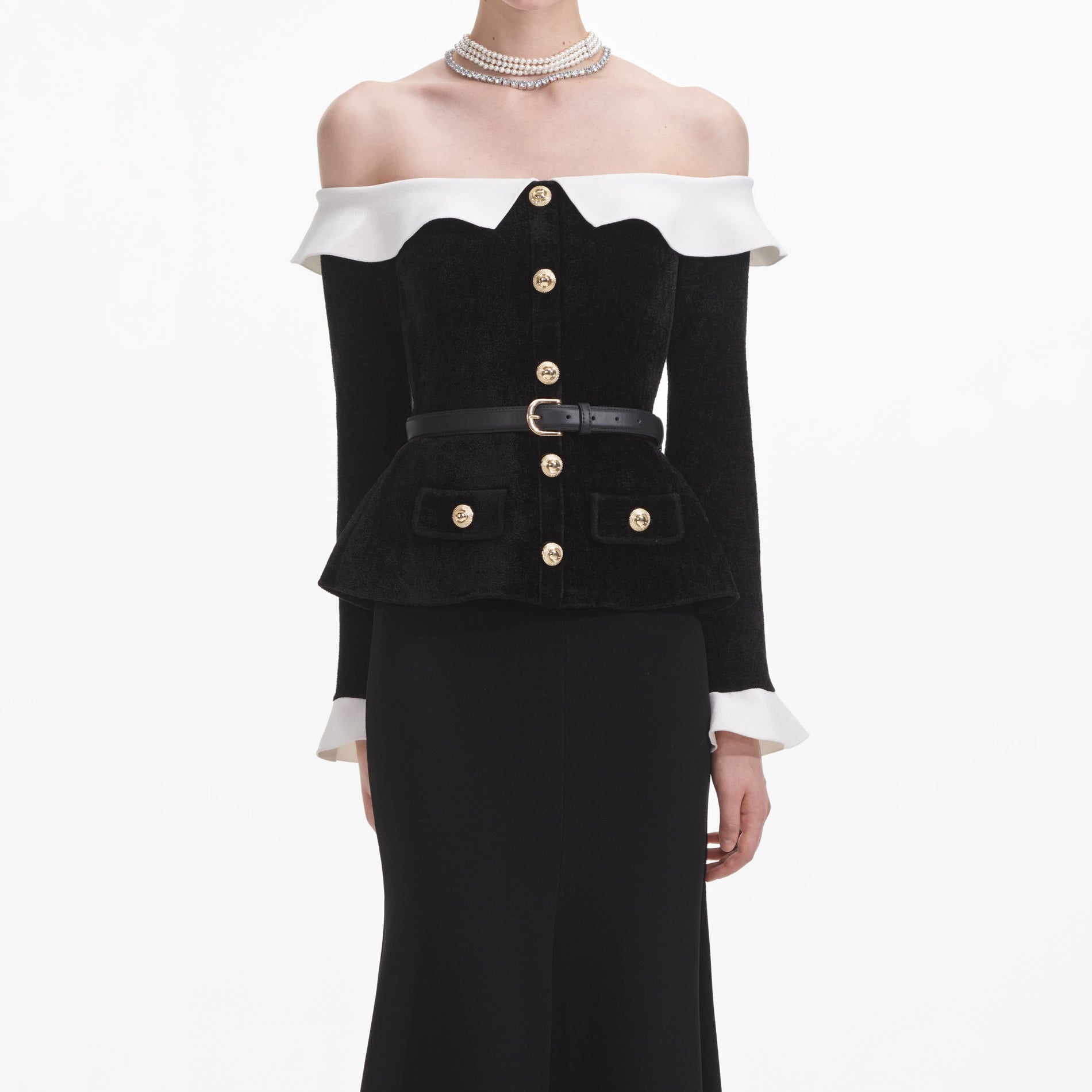 A close up of a woman wearing the Black Chenille Knit Off Shoulder Midi Dress