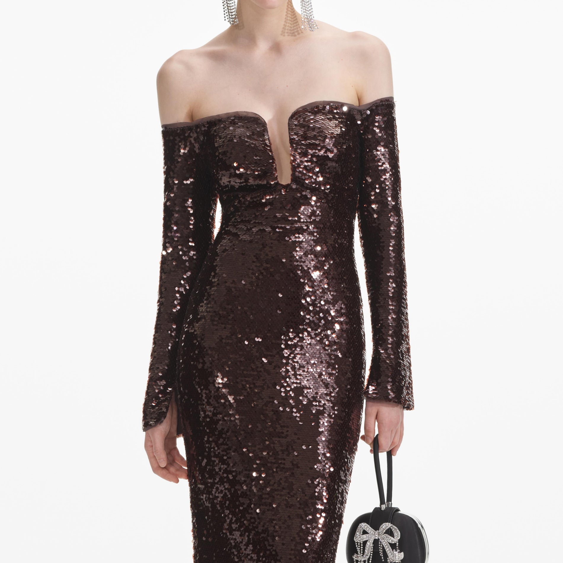 A close up of a woman wearing the Brown Sequin Off Shoulder Maxi Dress