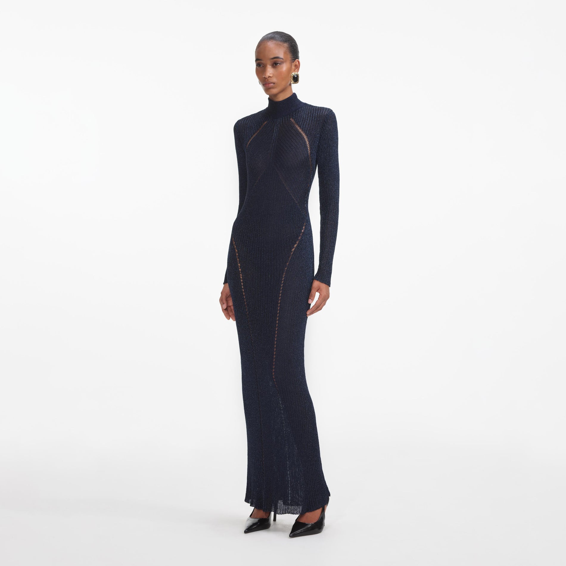 Side view of a woman wearing the Navy Lurex Knit Maxi Dress