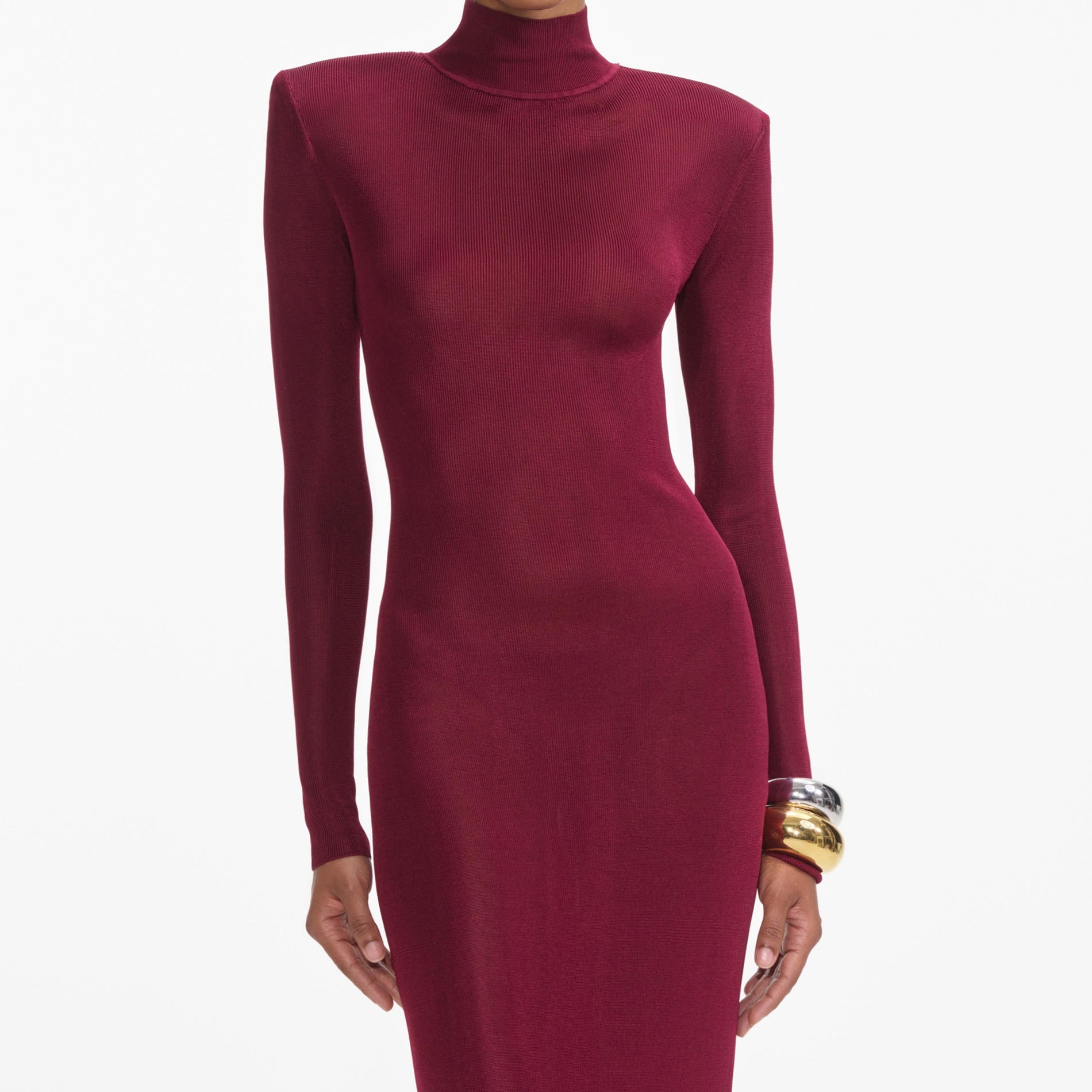 A close up of a woman wearing the Burgundy Viscose Knit Maxi Dress