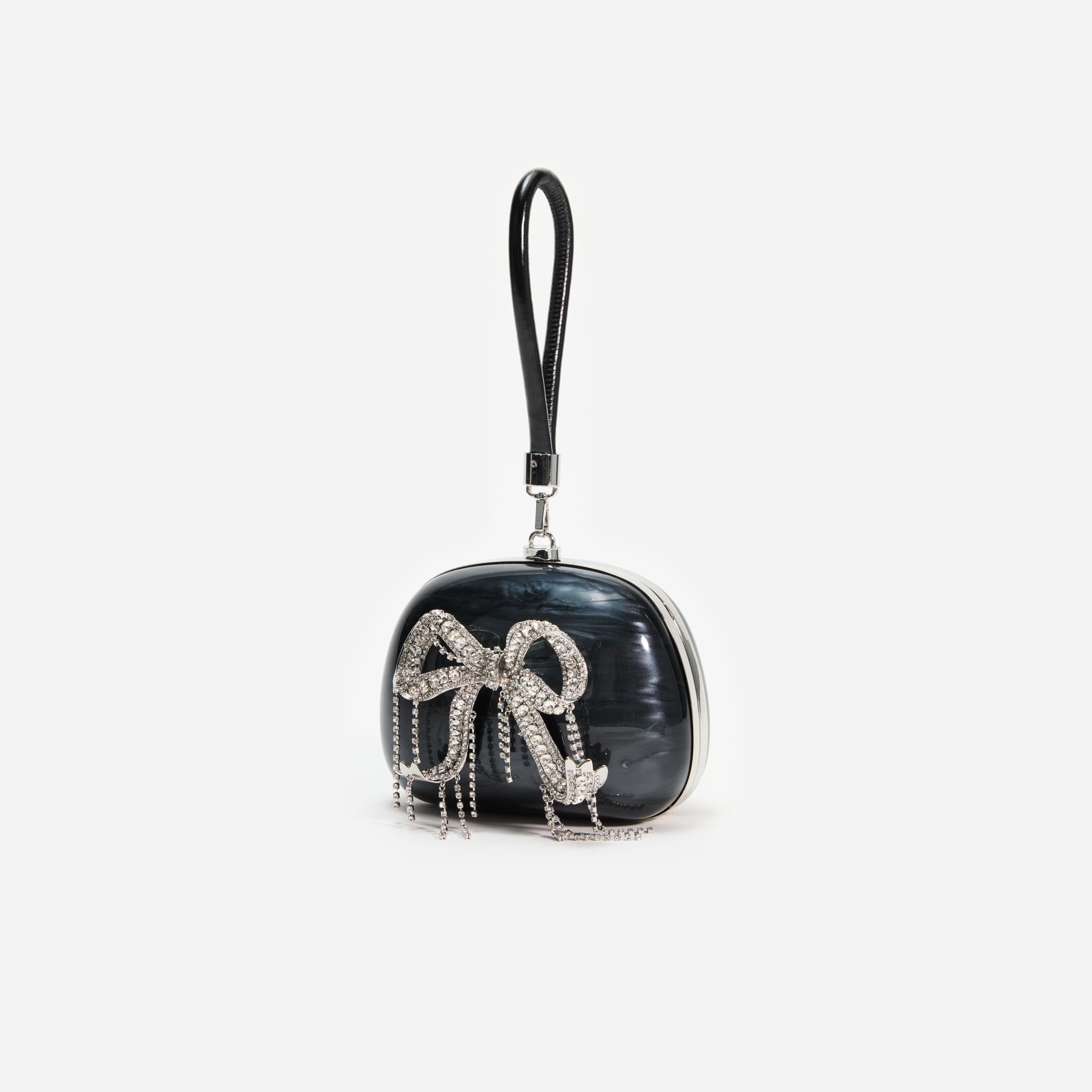 Side view of a woman wearing the Black Pearl Top Handle Clutch Bag