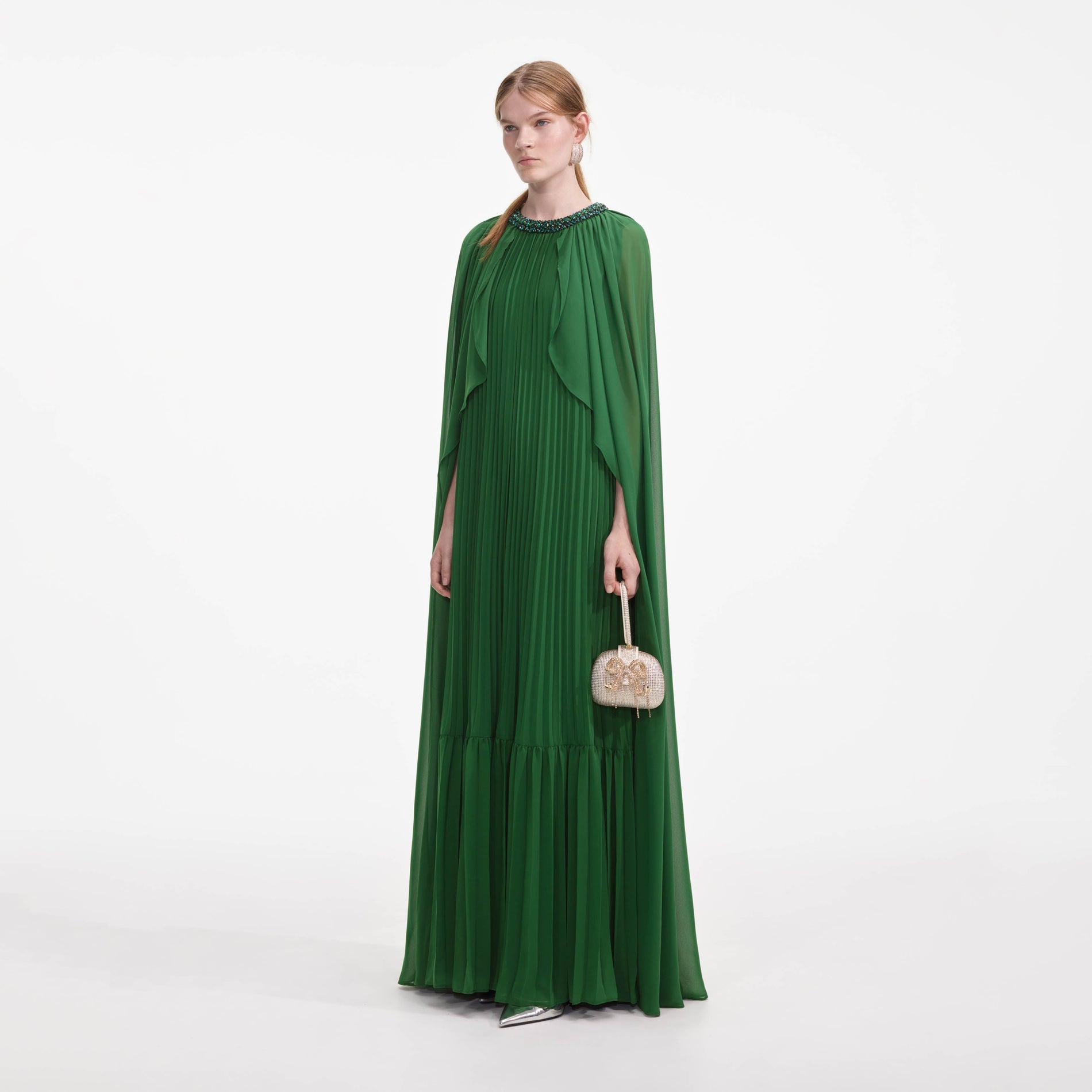 Side view of a woman wearing the Green Chiffon Cape Maxi Dress