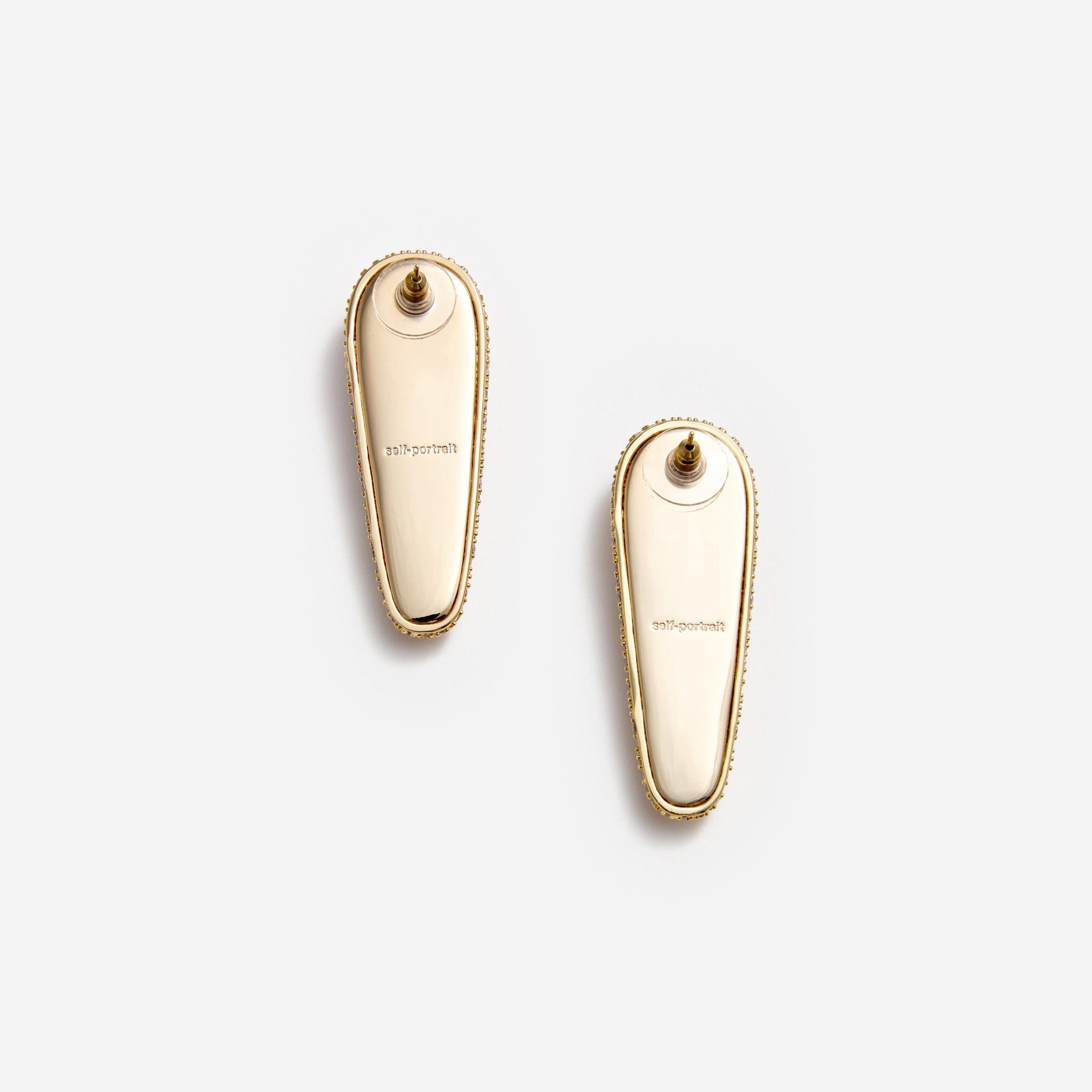 Side view of a woman wearing the Gold Crystal Bar Earrings