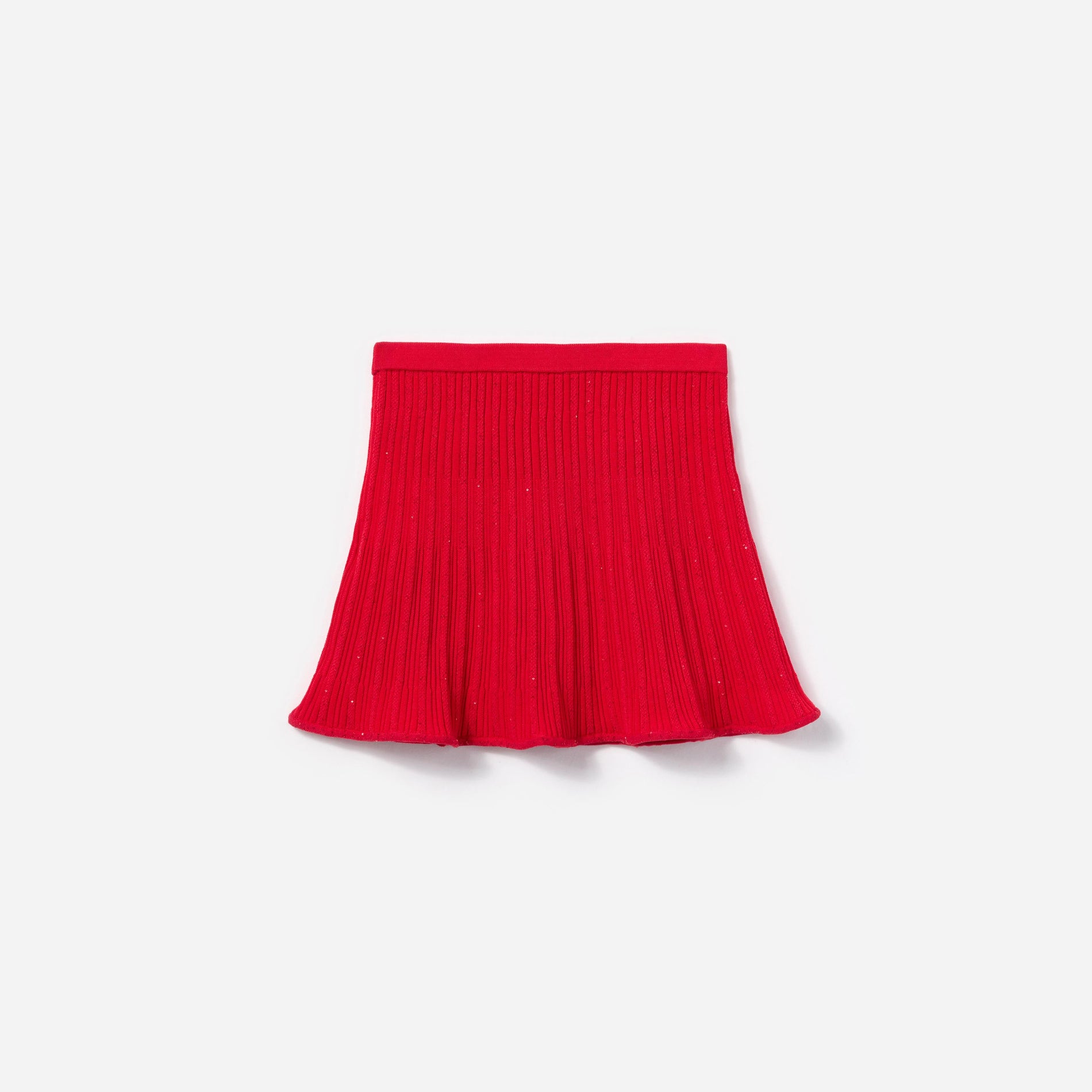 Side view of a woman wearing the Red Ribbed Knit Skirt