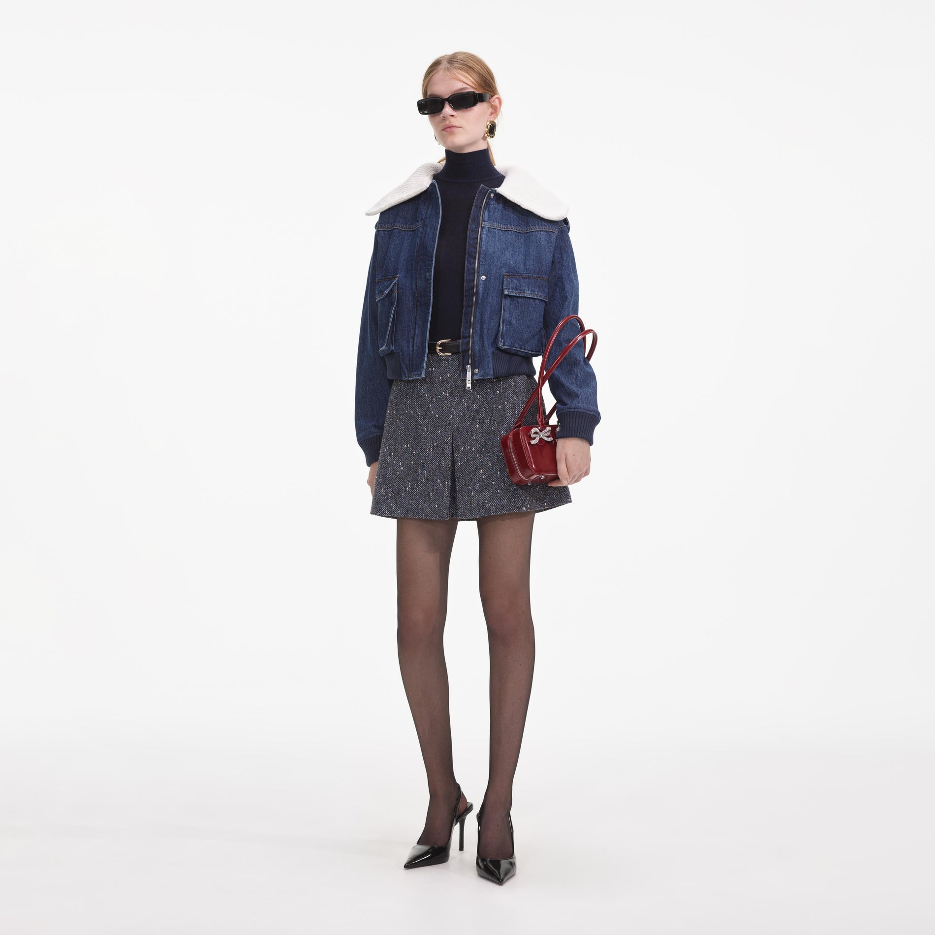 Side view of a woman wearing the Denim Knit Collar Jacket