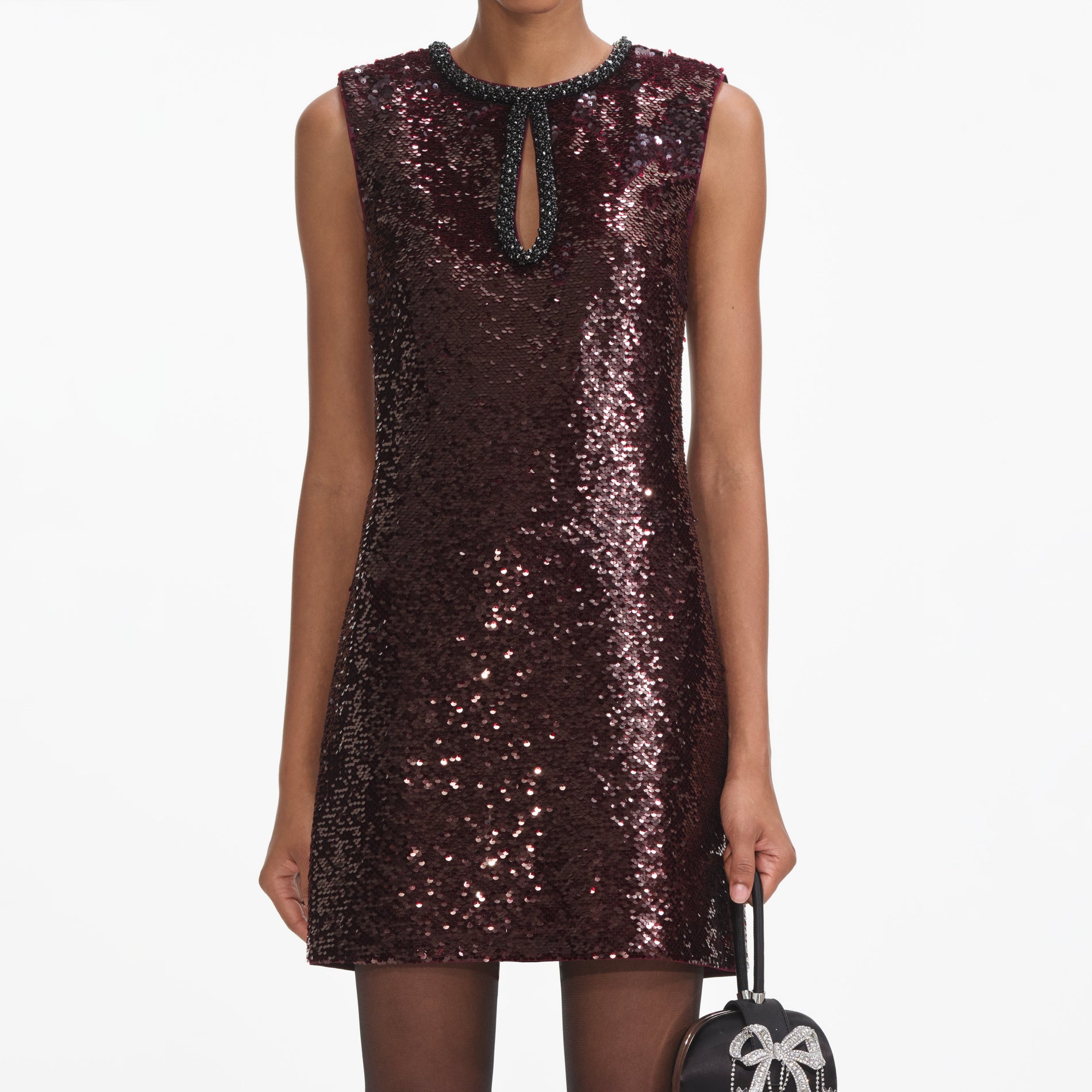 A close up of a woman wearing the Burgundy Sequin Mini Dress