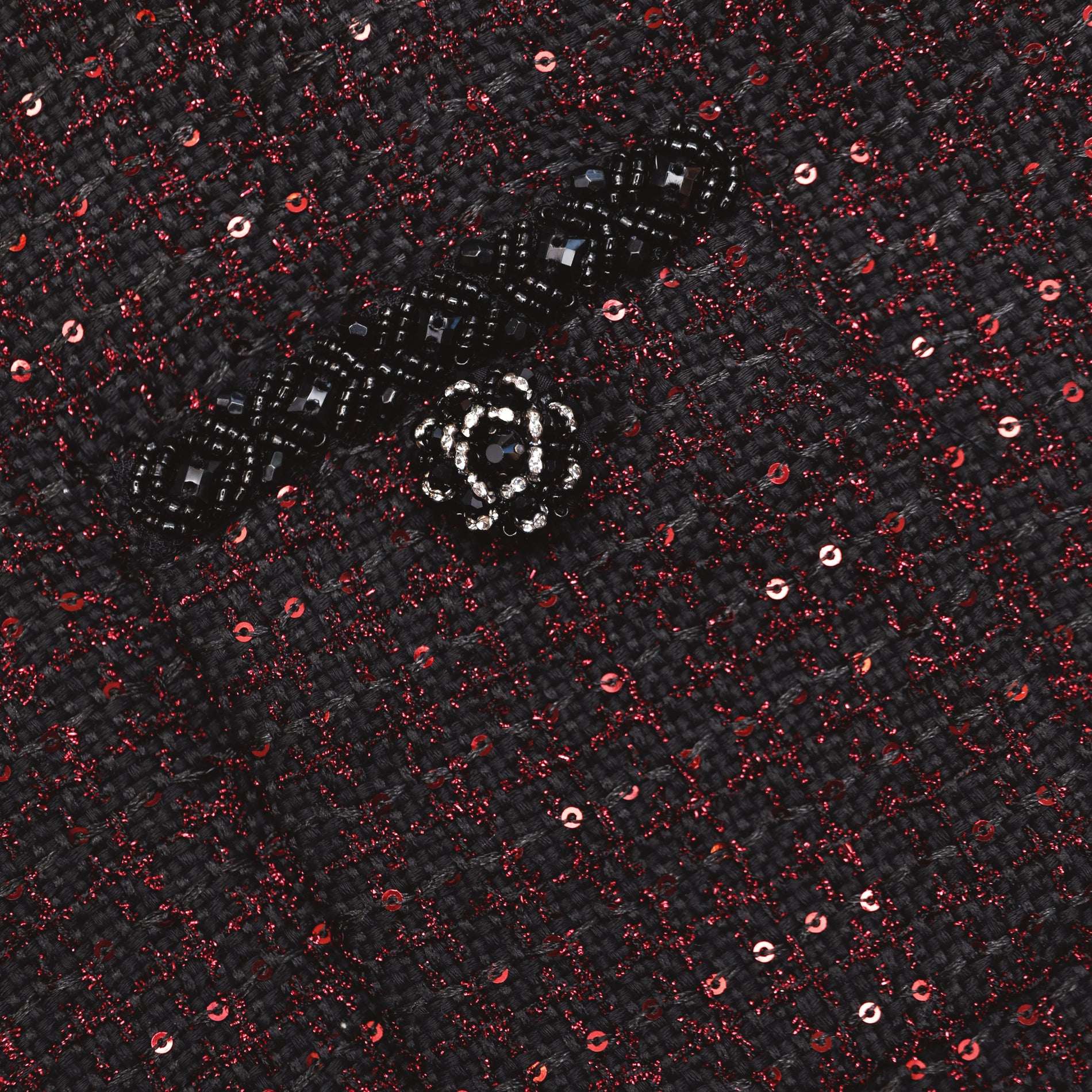 A close up of the fabric for the Black Metallic Boucle Midi Skirt
