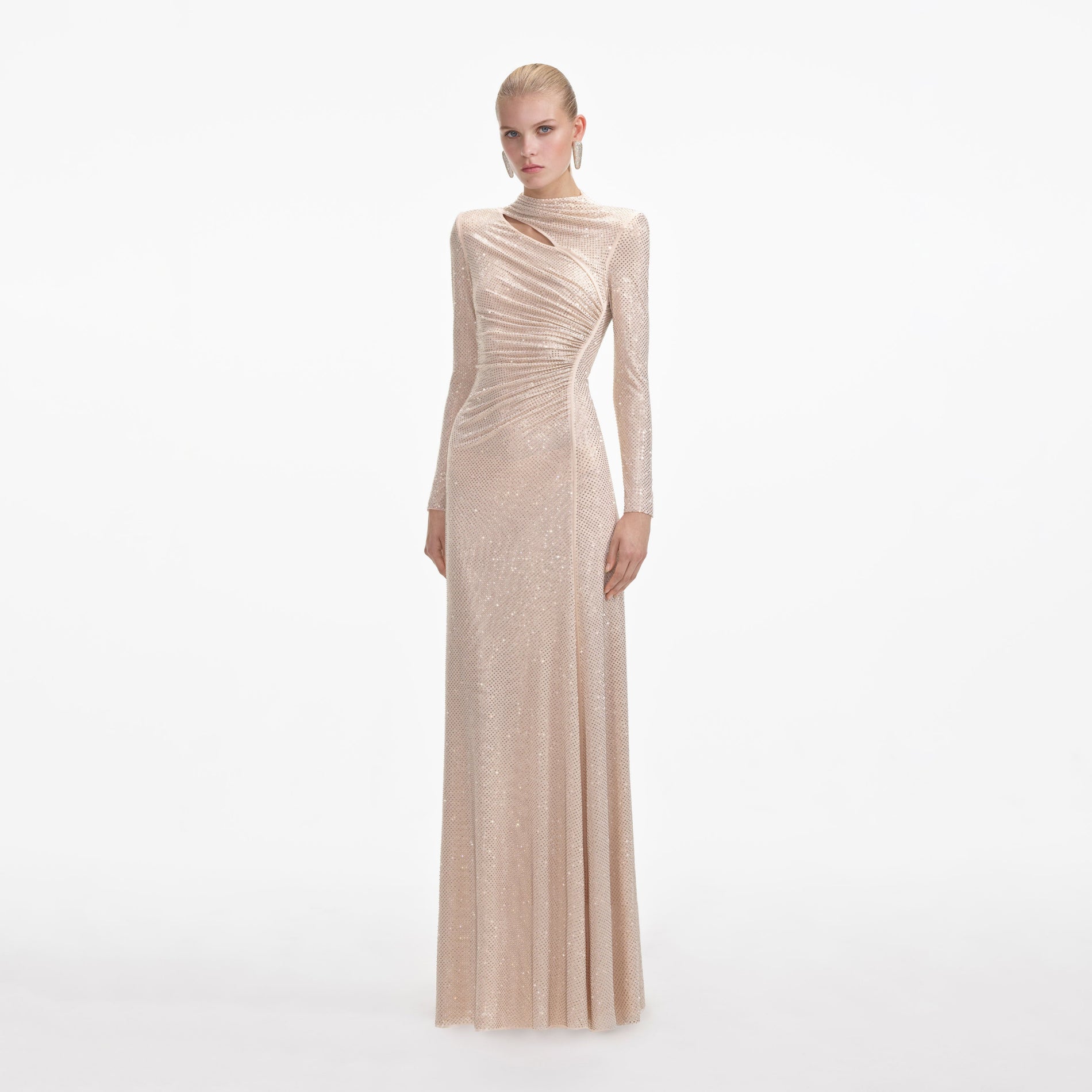 Side view of a woman wearing the Gold Rhinestone Mesh Cut Out Maxi Dress