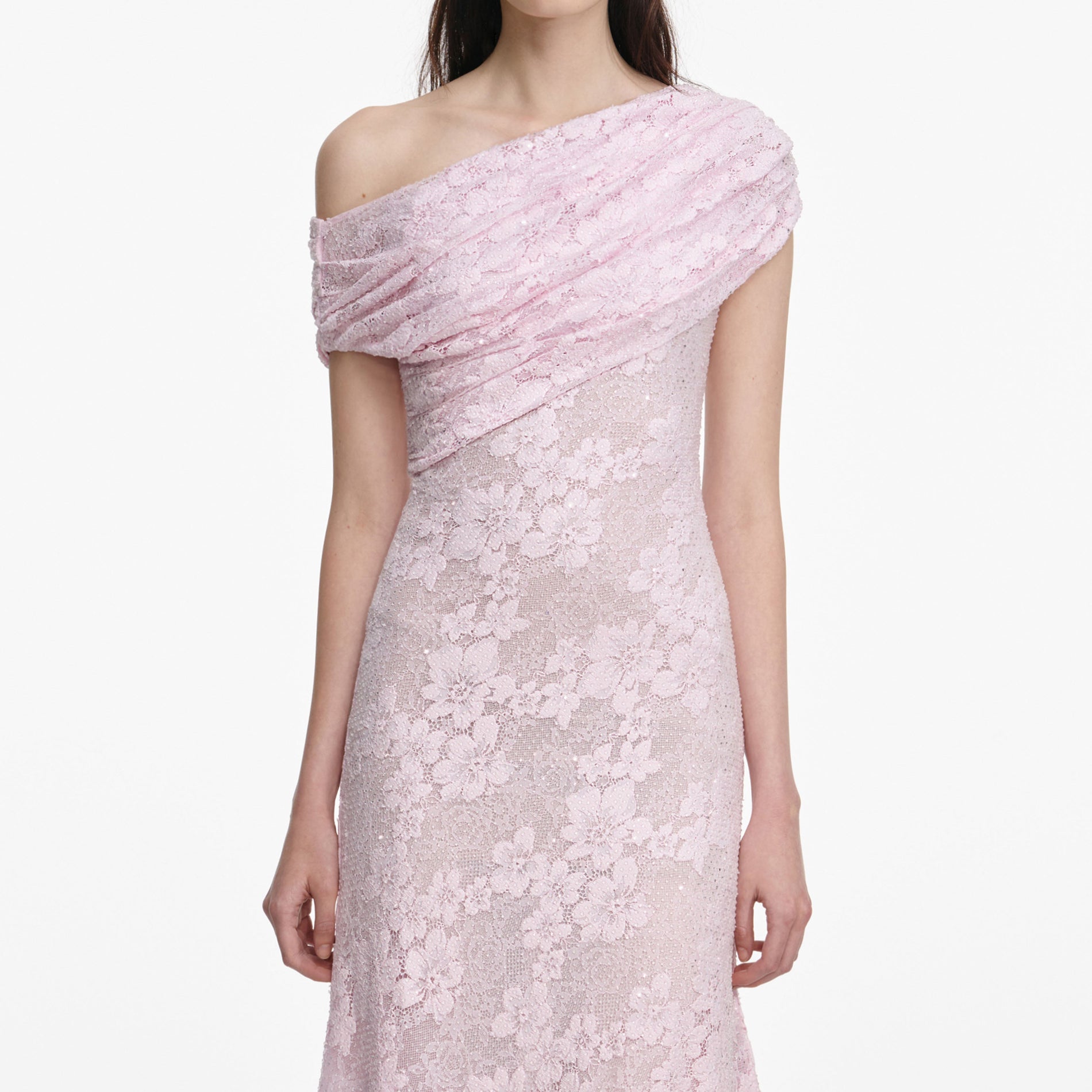 A close up of a woman wearing the Pink Rhinestone Lace Asymmetric Midi Dress