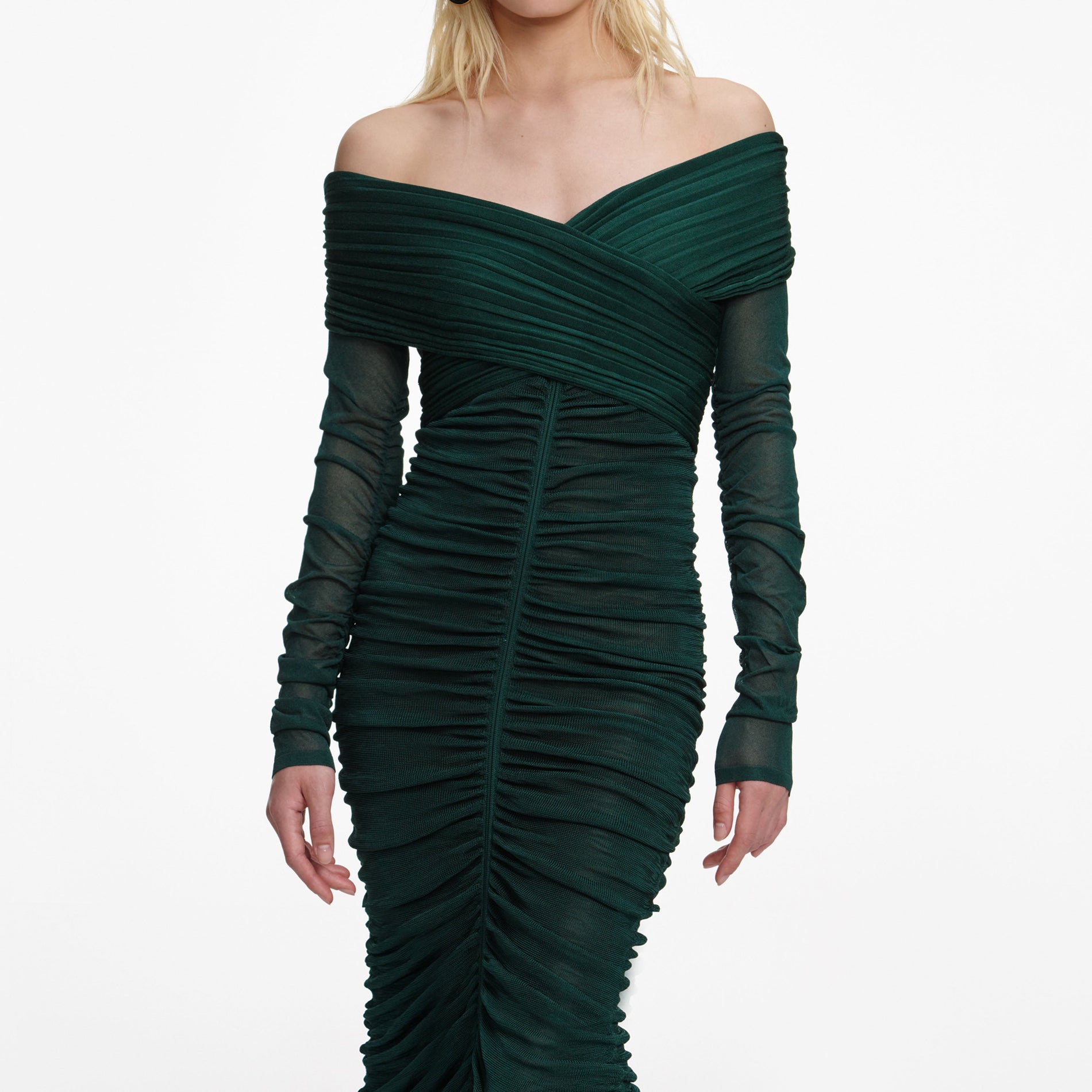 A close up of a woman wearing the Green Viscose Knit Midi Dress
