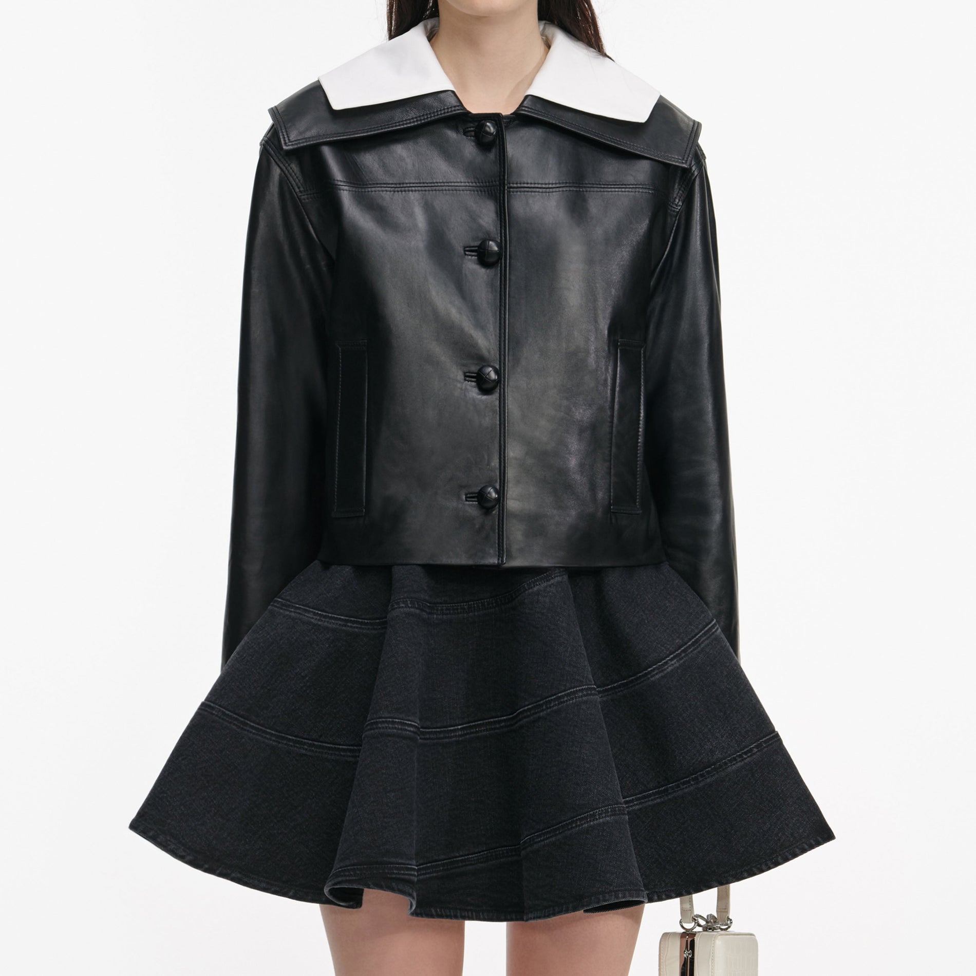 Side view of a woman wearing the Black Leather Contrast Collar Jacket