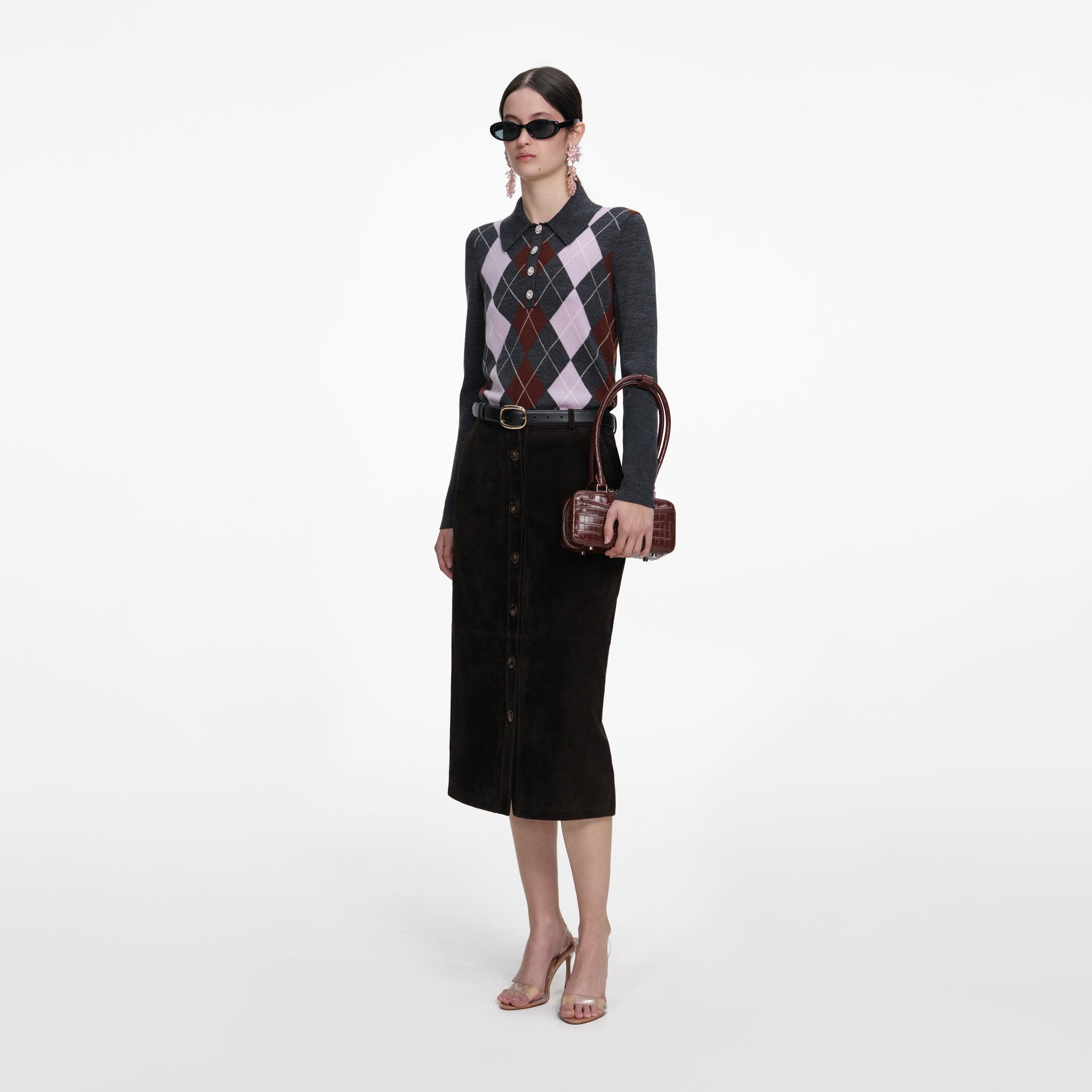 Side view of a woman wearing the Brown Suede Midi Skirt