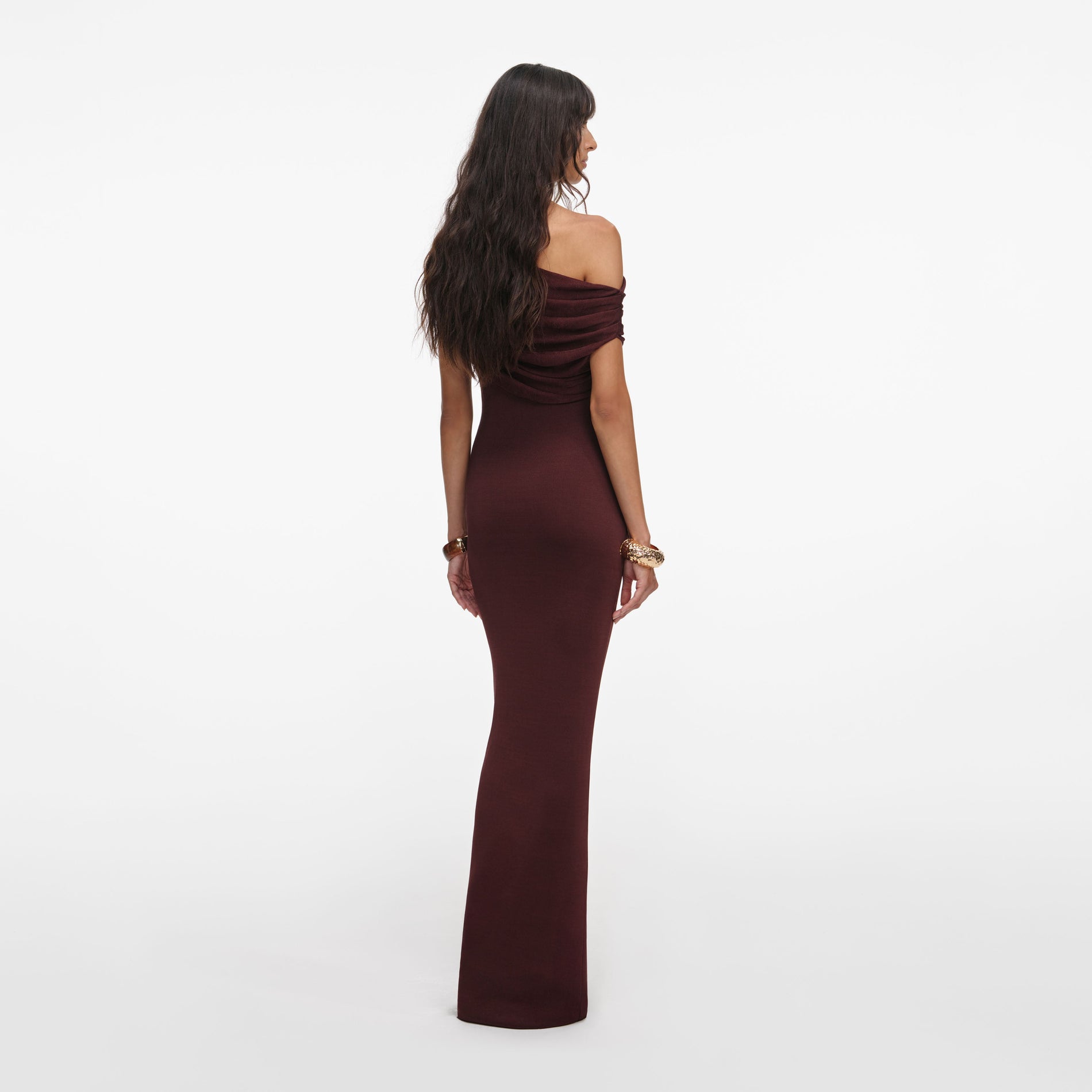 Back view of a woman wearing the Brown Draped Knit Midi Dress
