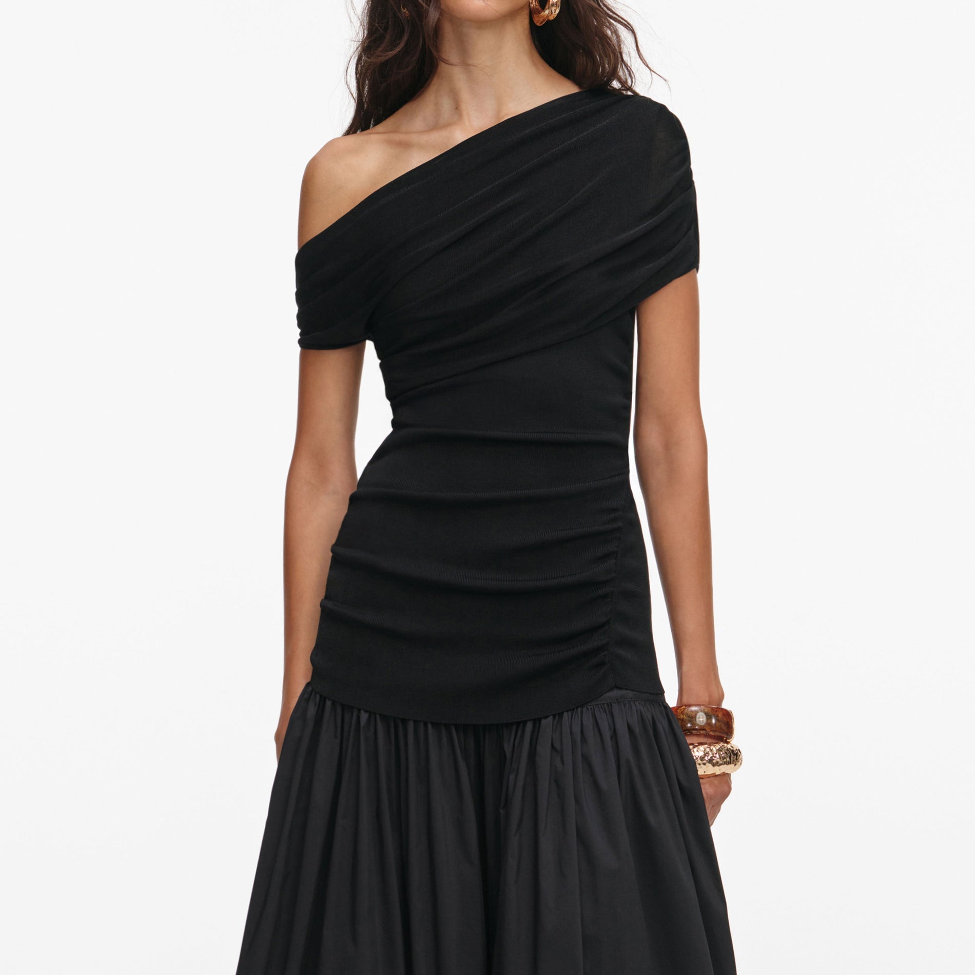 A close up of a woman wearing the Black Cotton Draped Knit Midi Dress