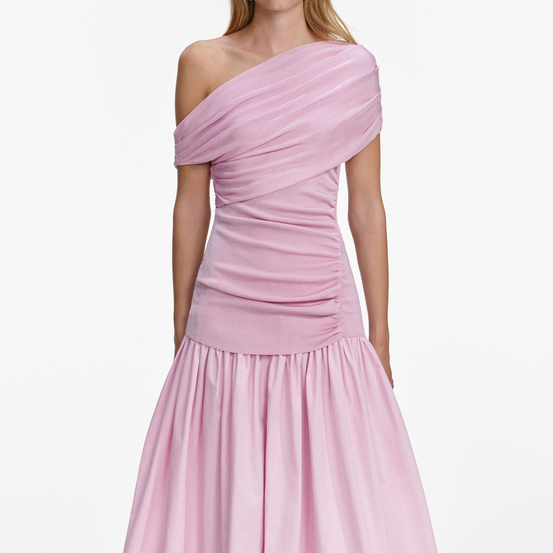 A close up of a woman wearing the Pink Cotton Draped Knit Midi Dress