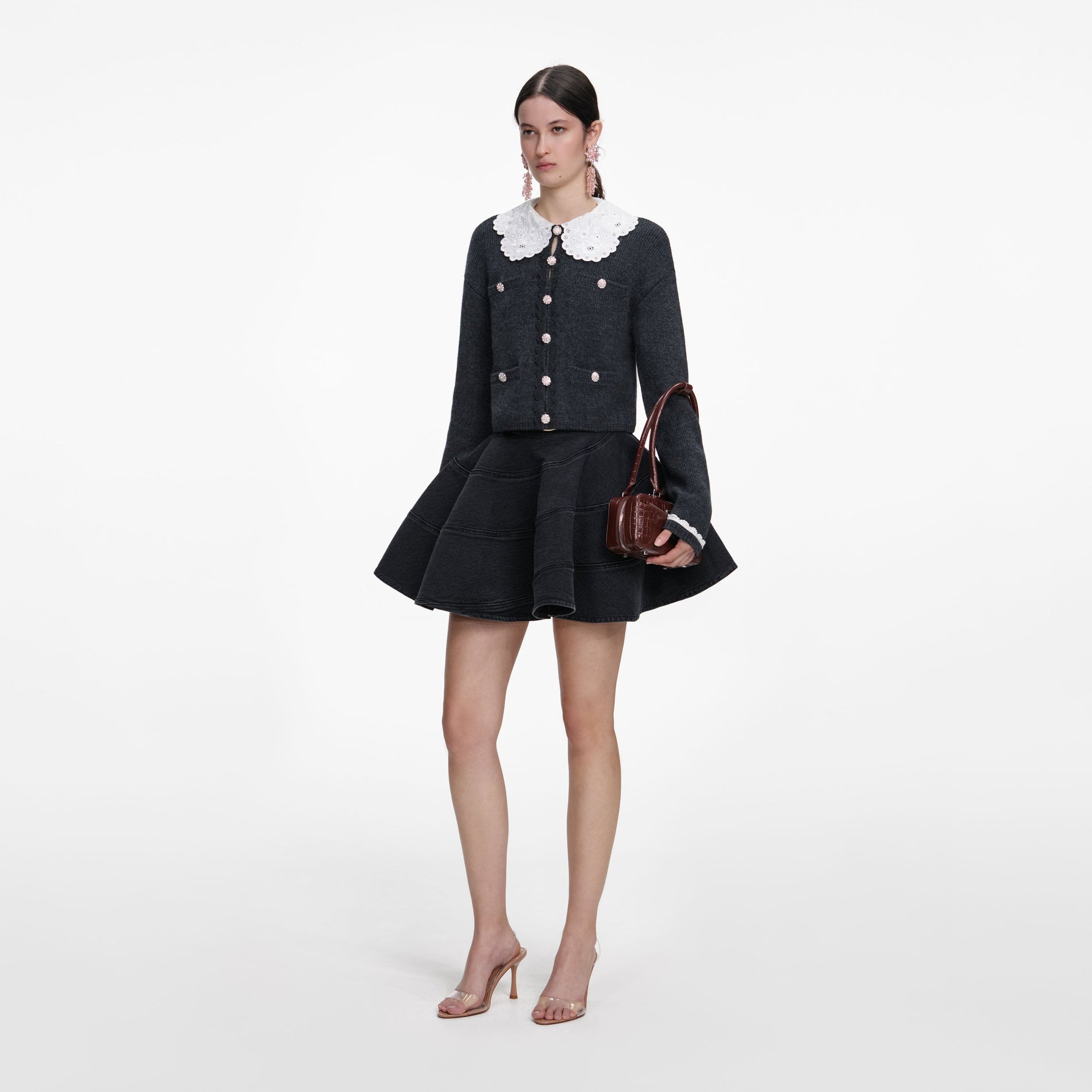 Side view of a woman wearing the Charcoal Lace Collar Cardigan