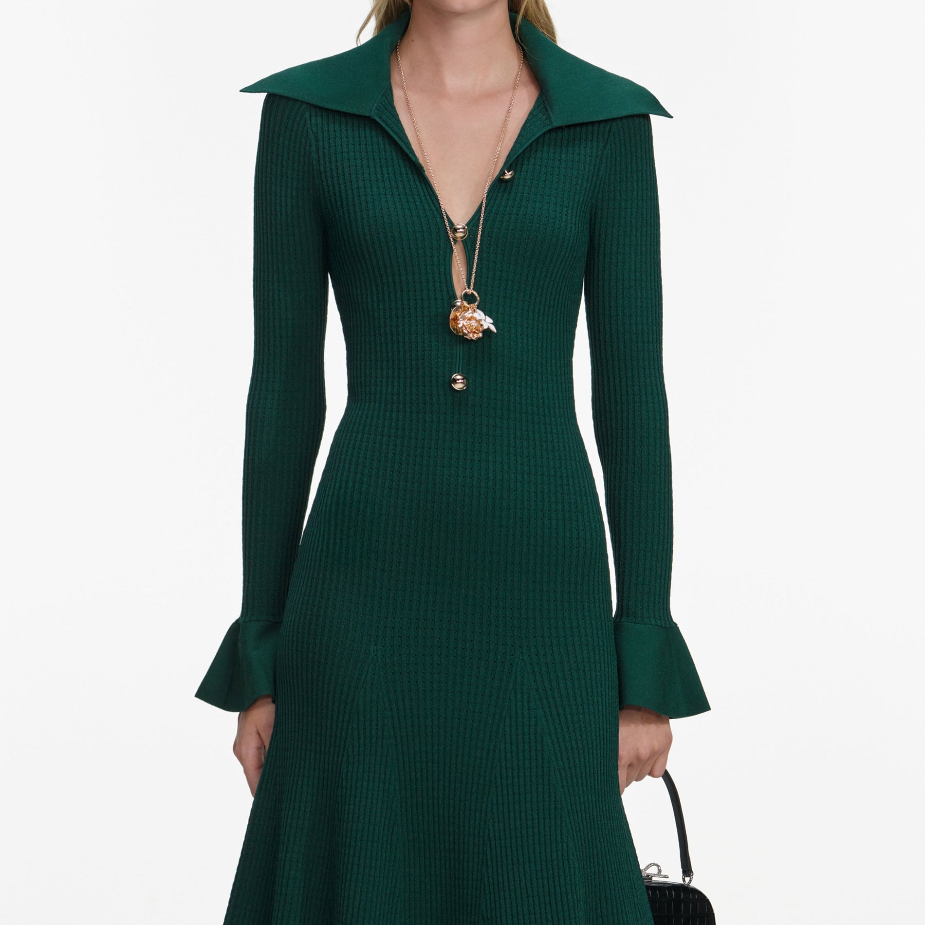 A close up of a woman wearing the Green Keyhole Knit Midi Dress
