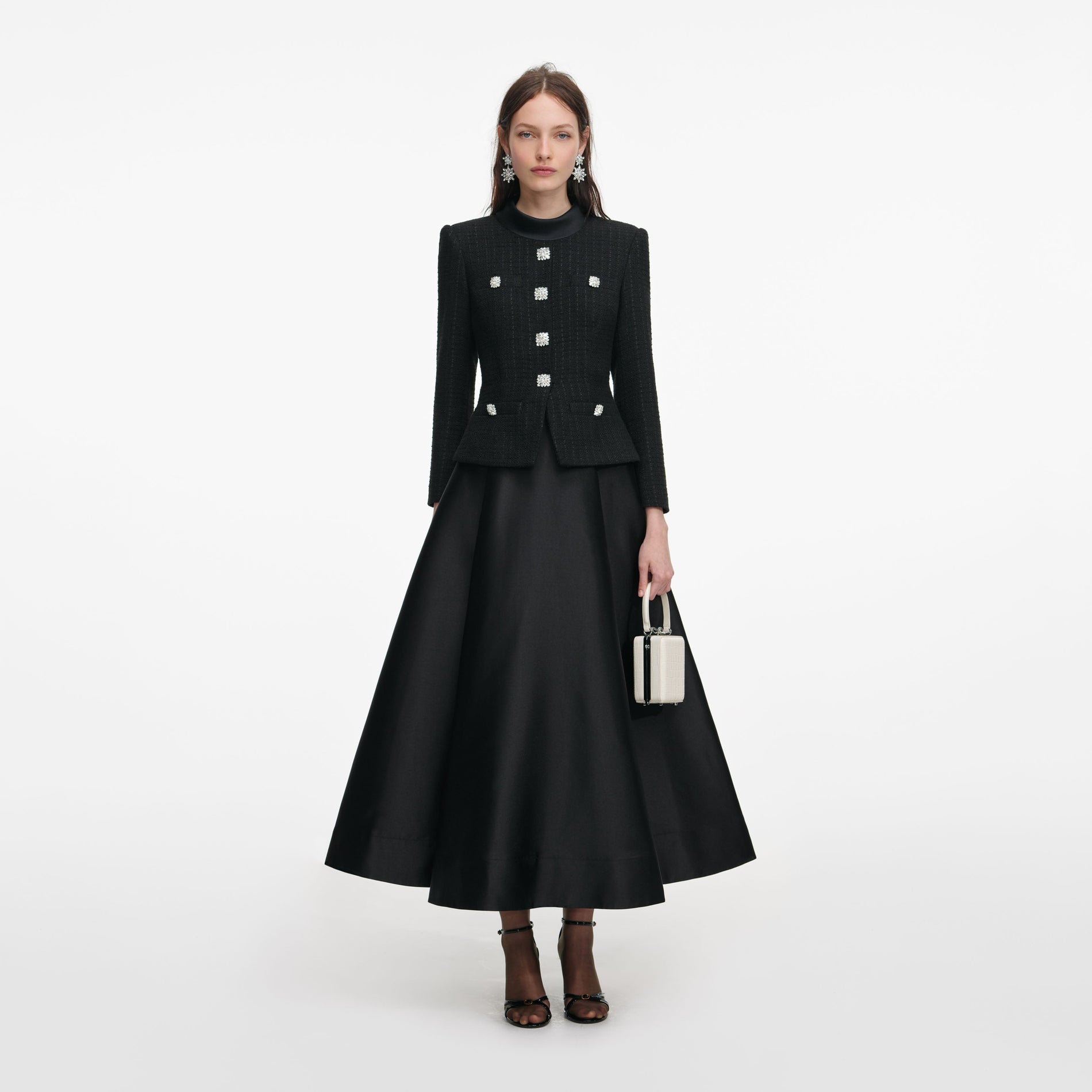 Front view of a woman wearing the Black Boucle Taffeta Midi Dress