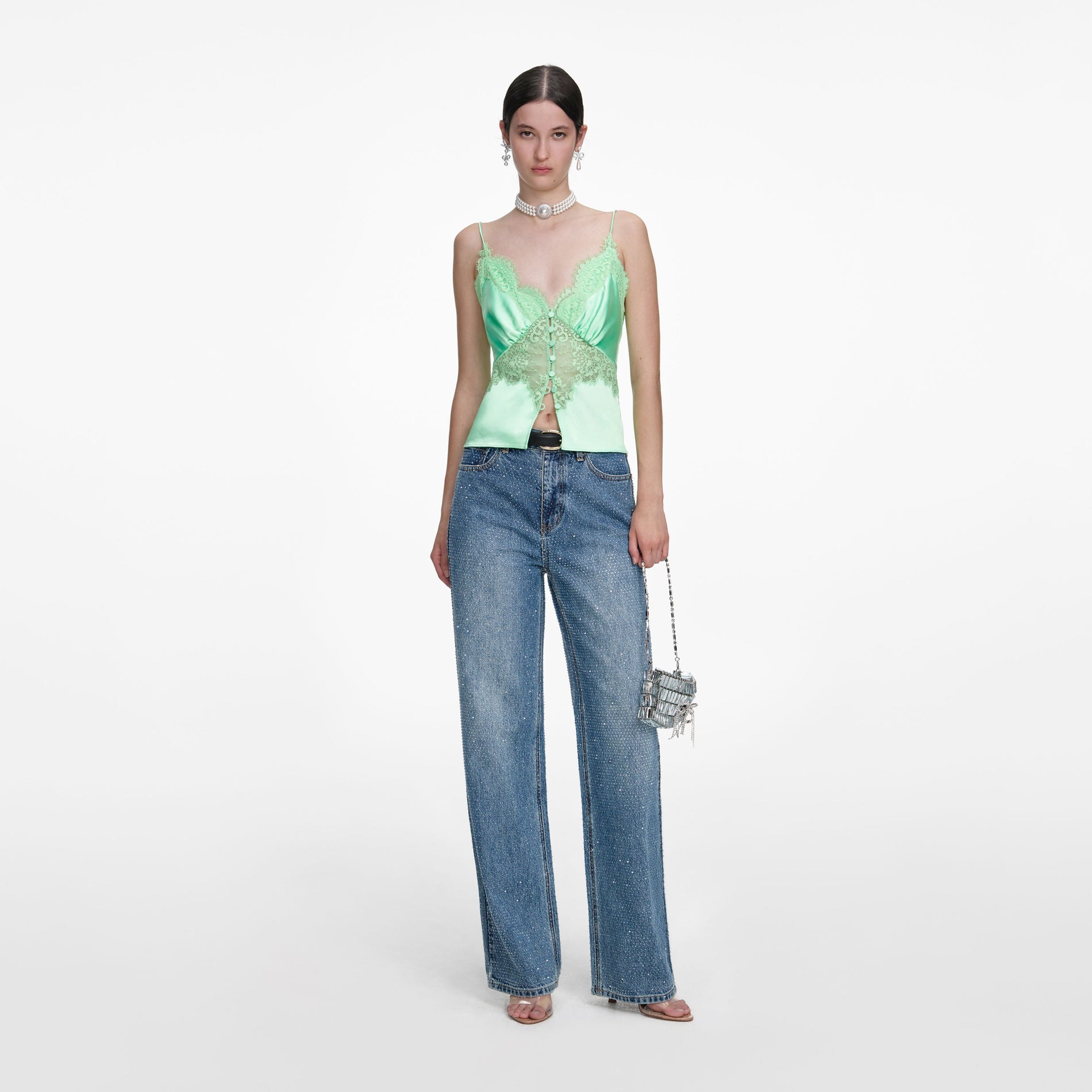 Front view of a woman wearing the Green Satin Lace Top