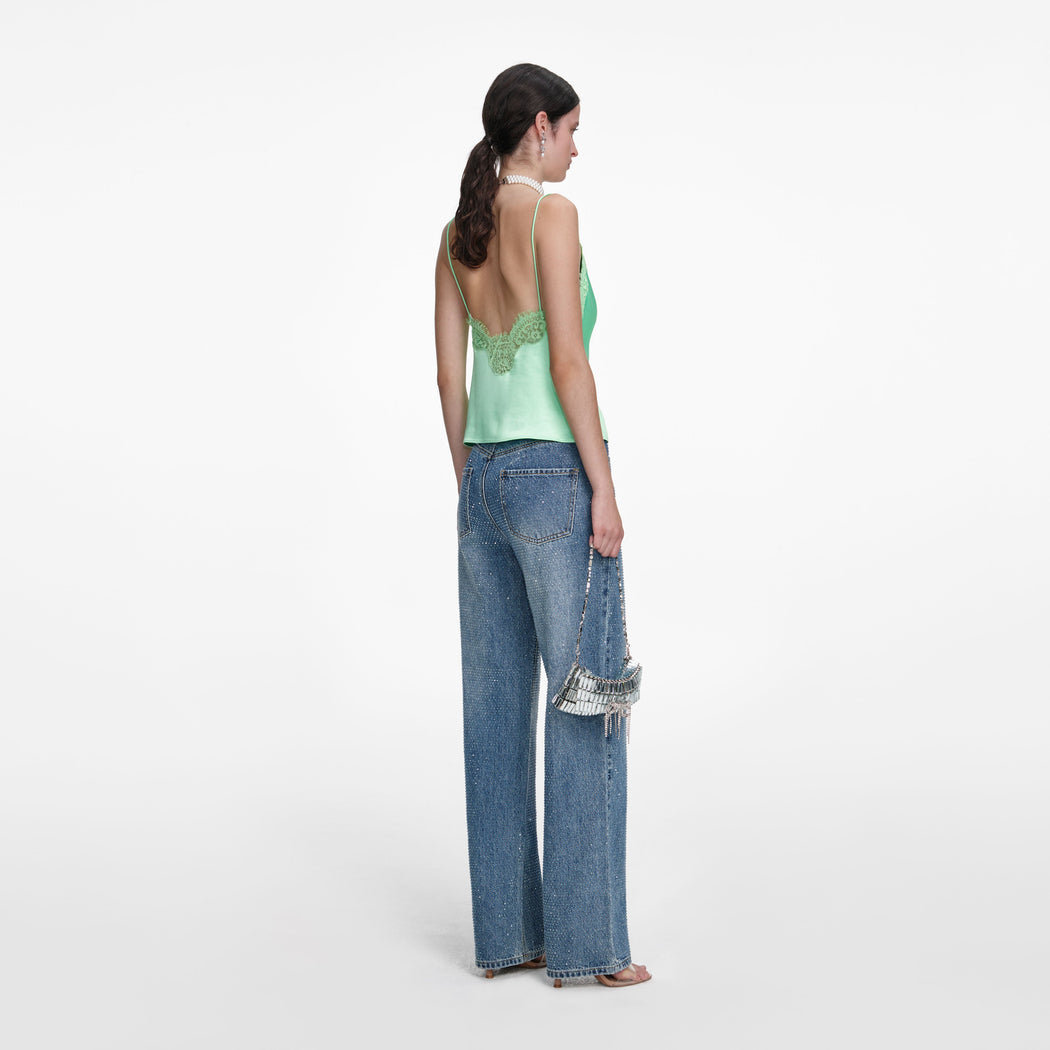 Back view of a woman wearing the Green Satin Lace Top
