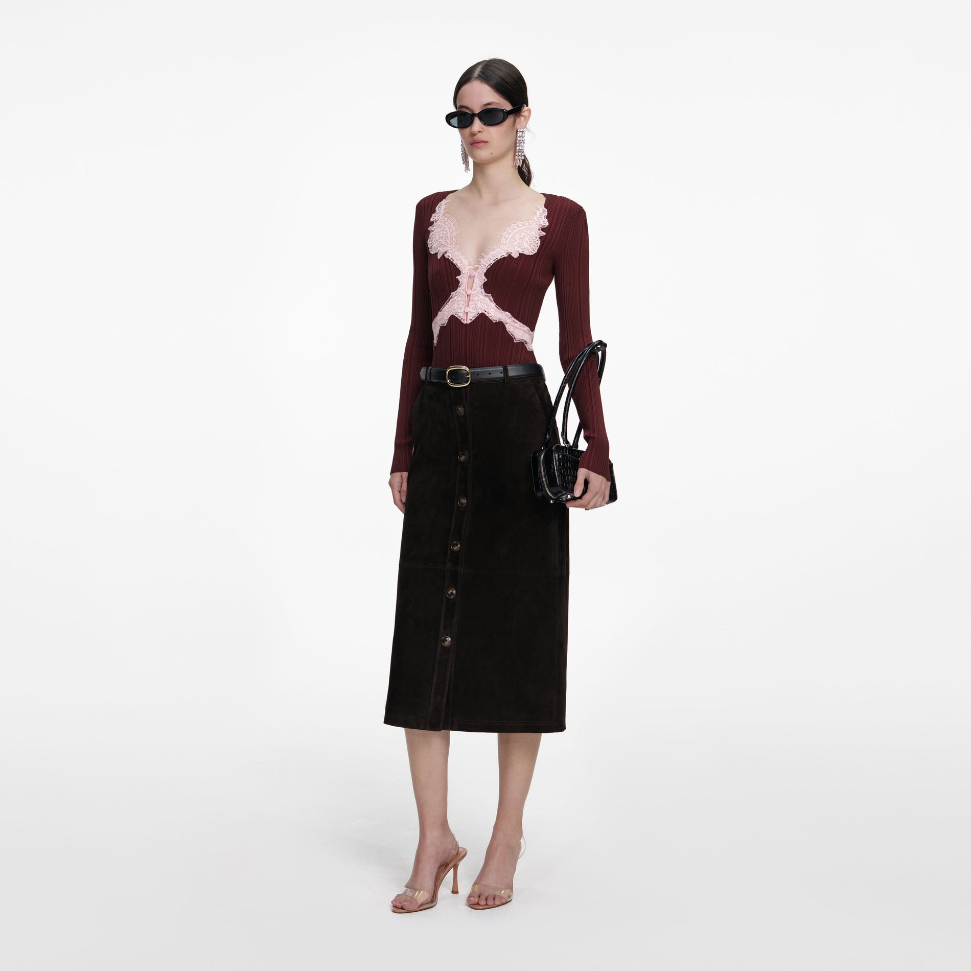 Side view of a woman wearing the Brown Contrast Lace Knit Top
