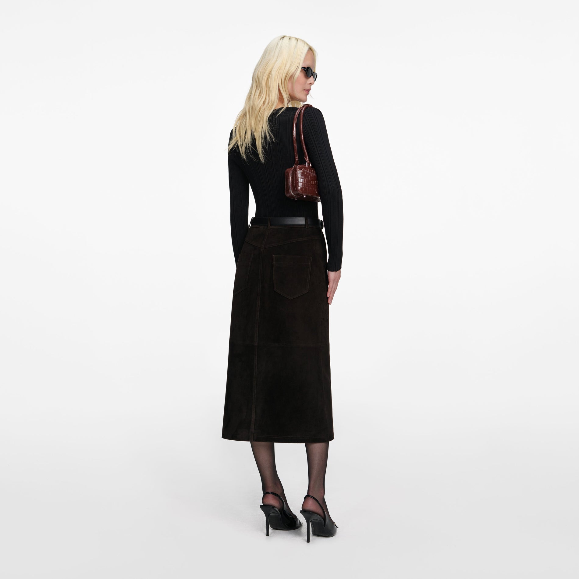 Back view of a woman wearing the Black Lace Knit Top